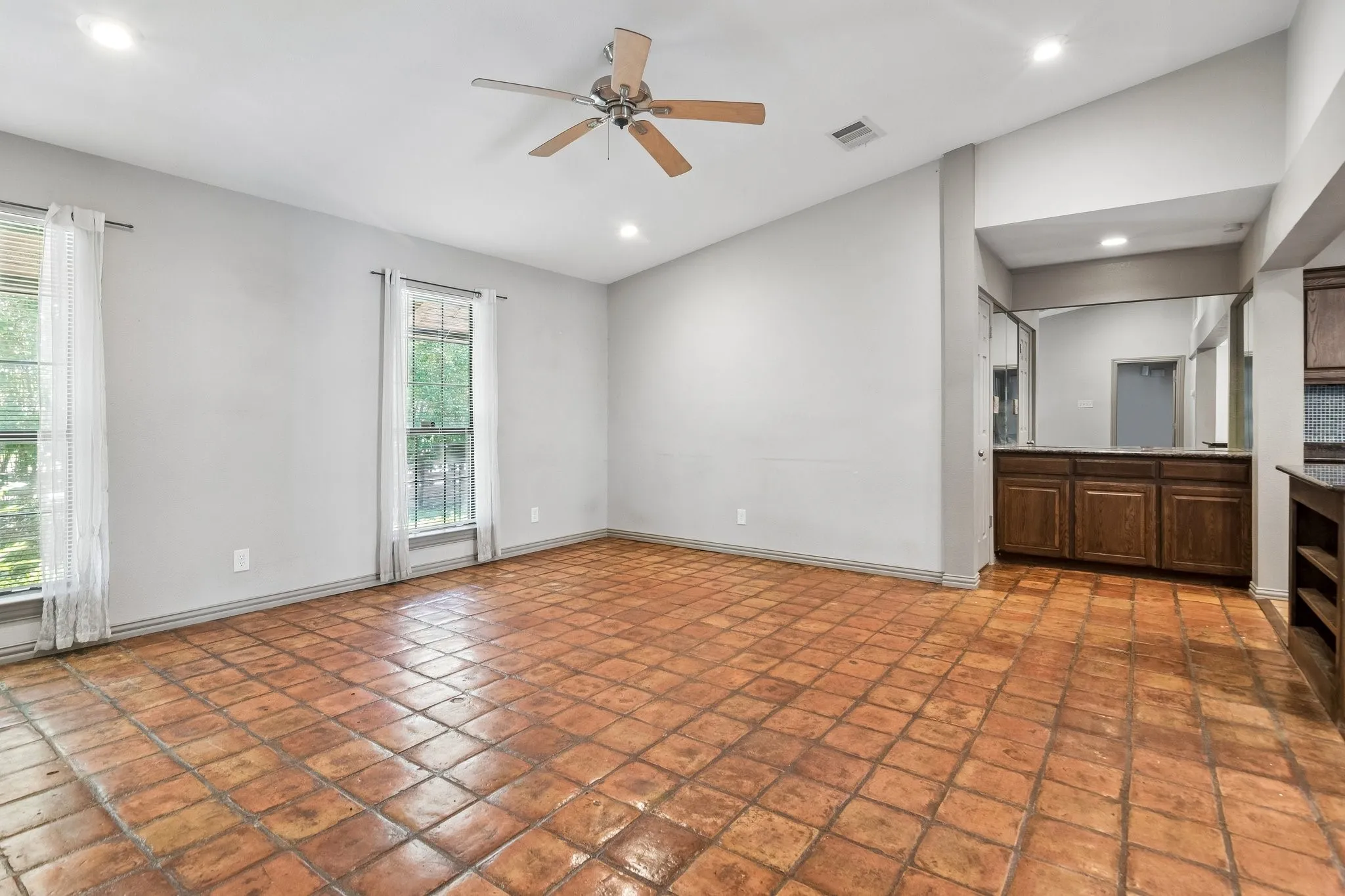 Dining room is light and bright adjacent to kitchen