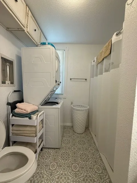 Stackable washer and dryer in bath