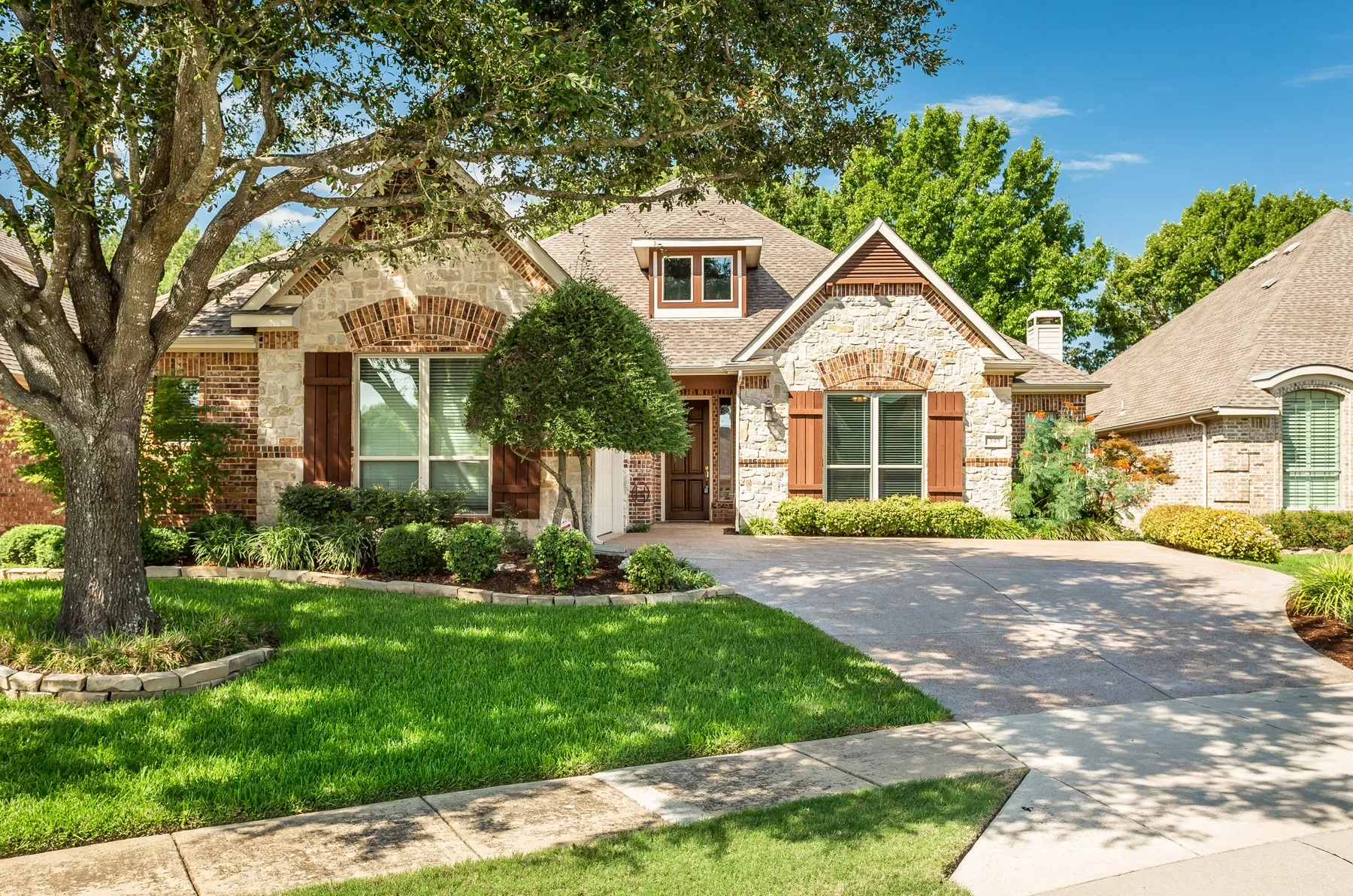 Brick and stone exterior with architectural shingles