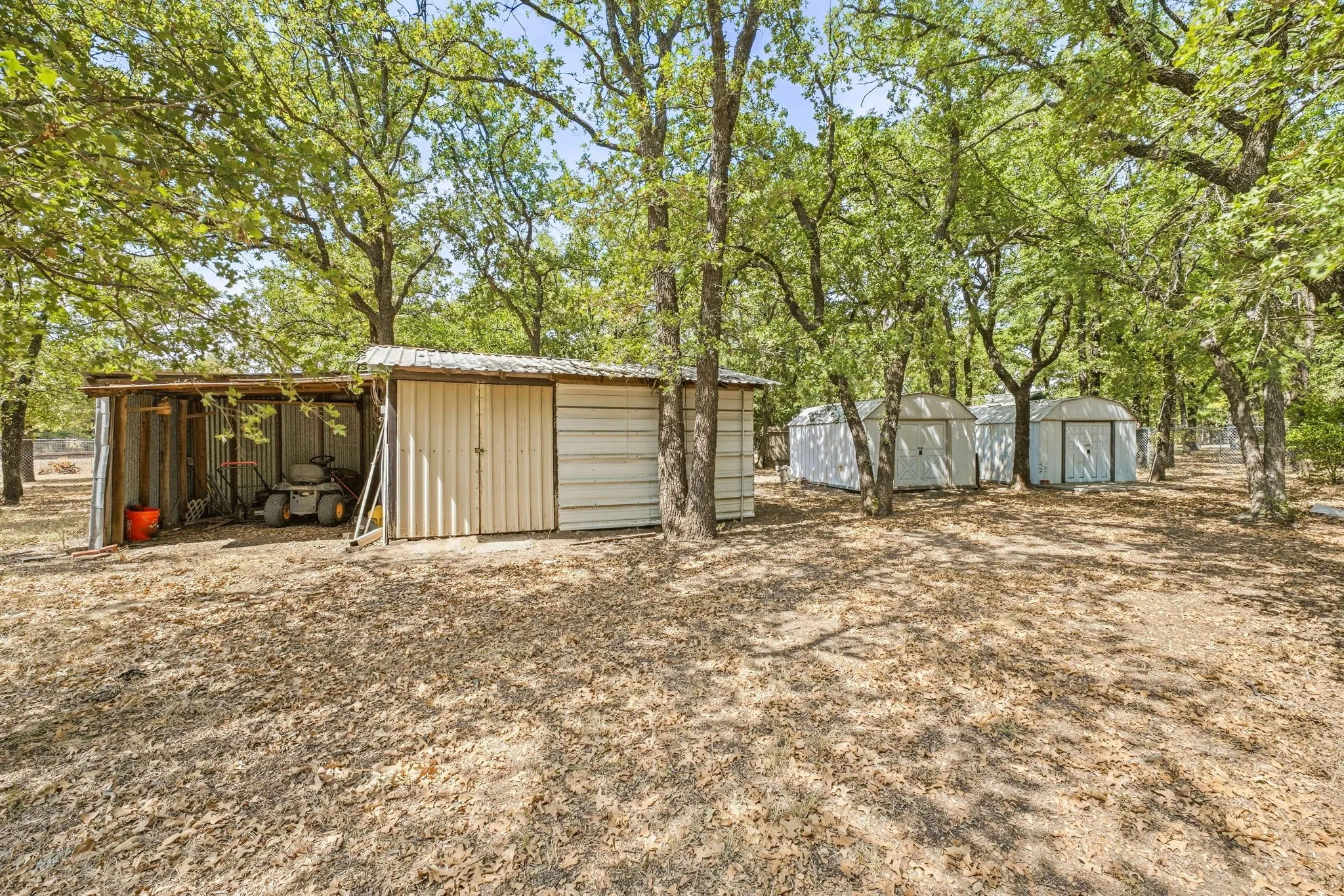 Multiple outbuildings provide ample storage