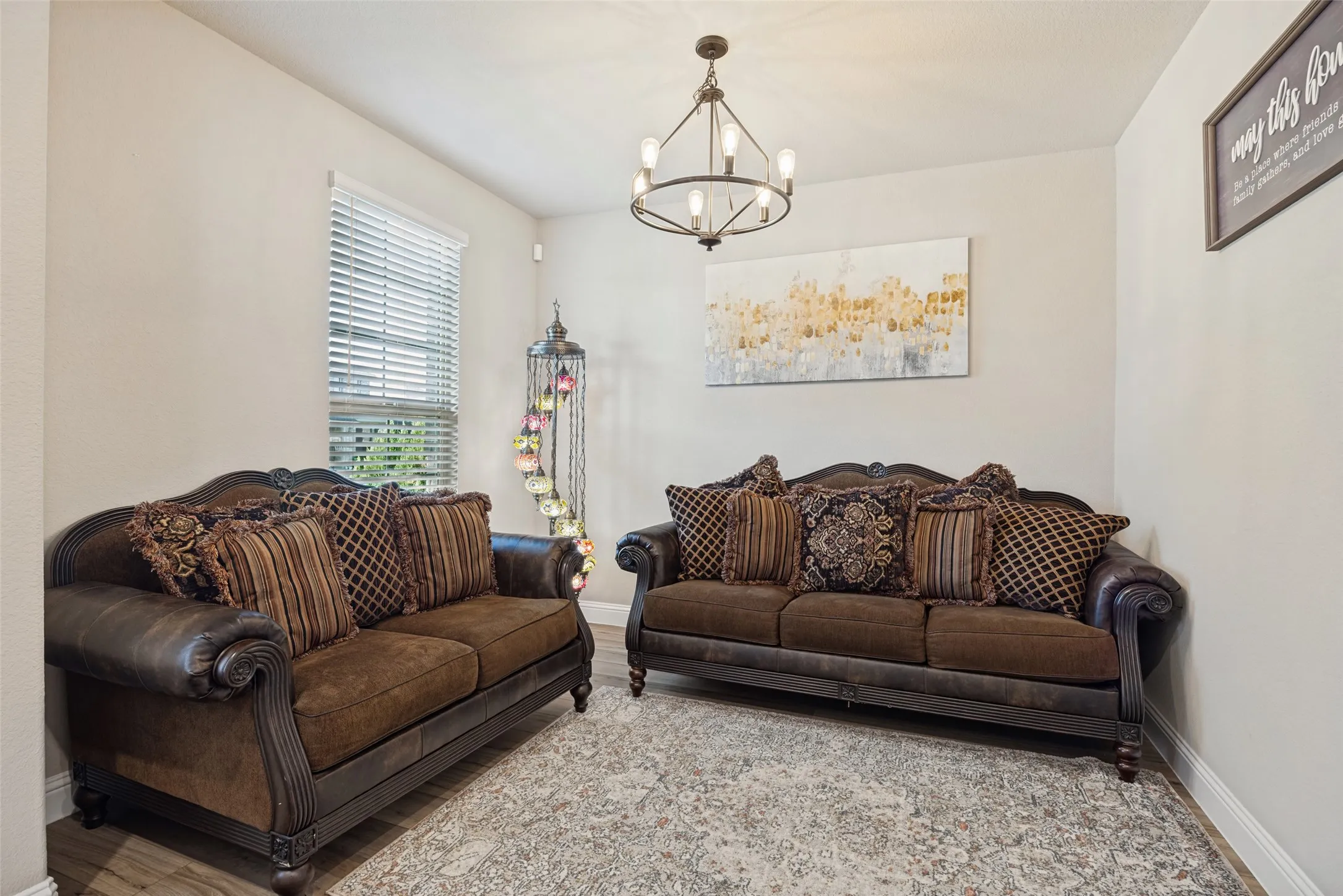 Recessed lighting, window with blinds, and a chandelier fixture