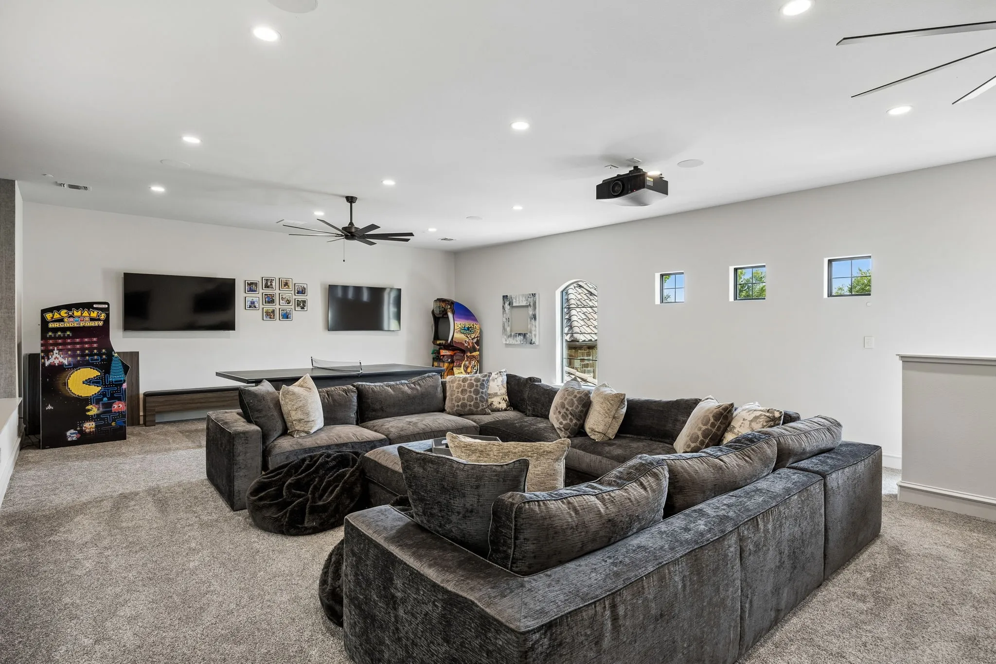 Stunning Entertaining Space looking down over Court with 5 TV's
