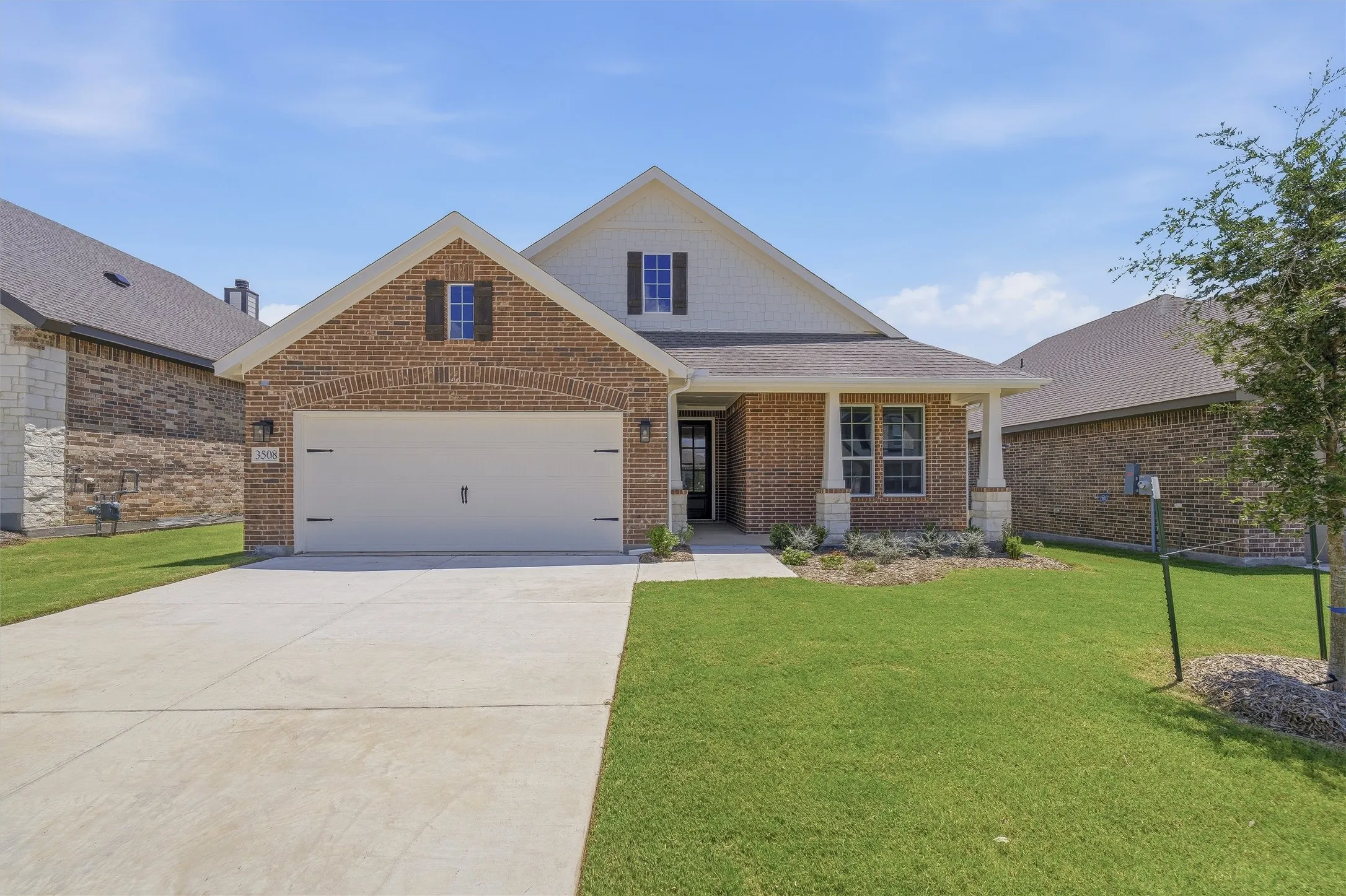 Brick and siding exterior with gabled roofline