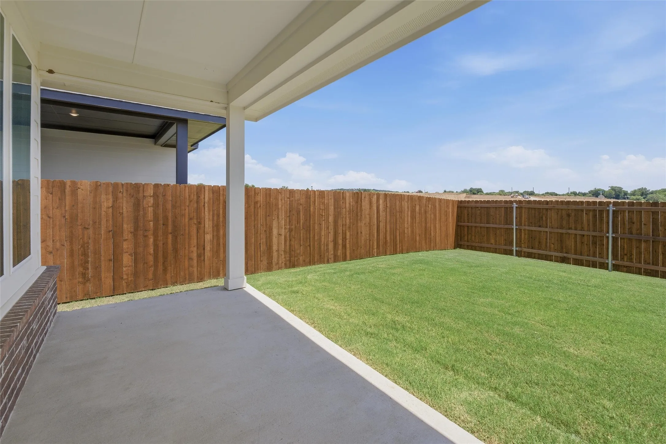 Covered patio with a concrete surface