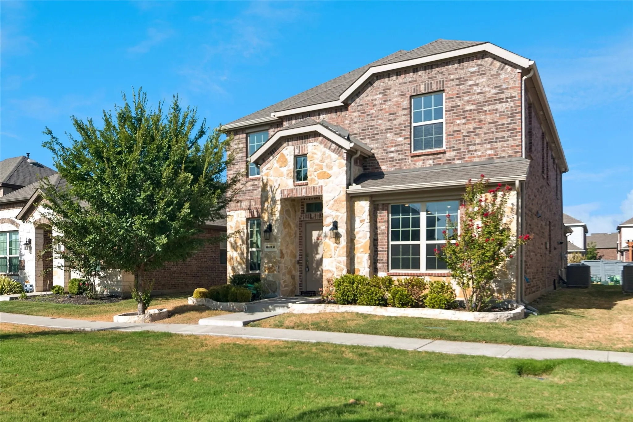 Brick and stone exterior with a gabled roofline