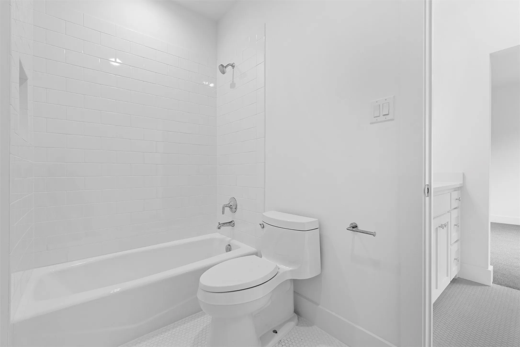 Second floor Jack and Jill bathroom featuring tiled shower / bath, vanity, toilet, and tile floors
