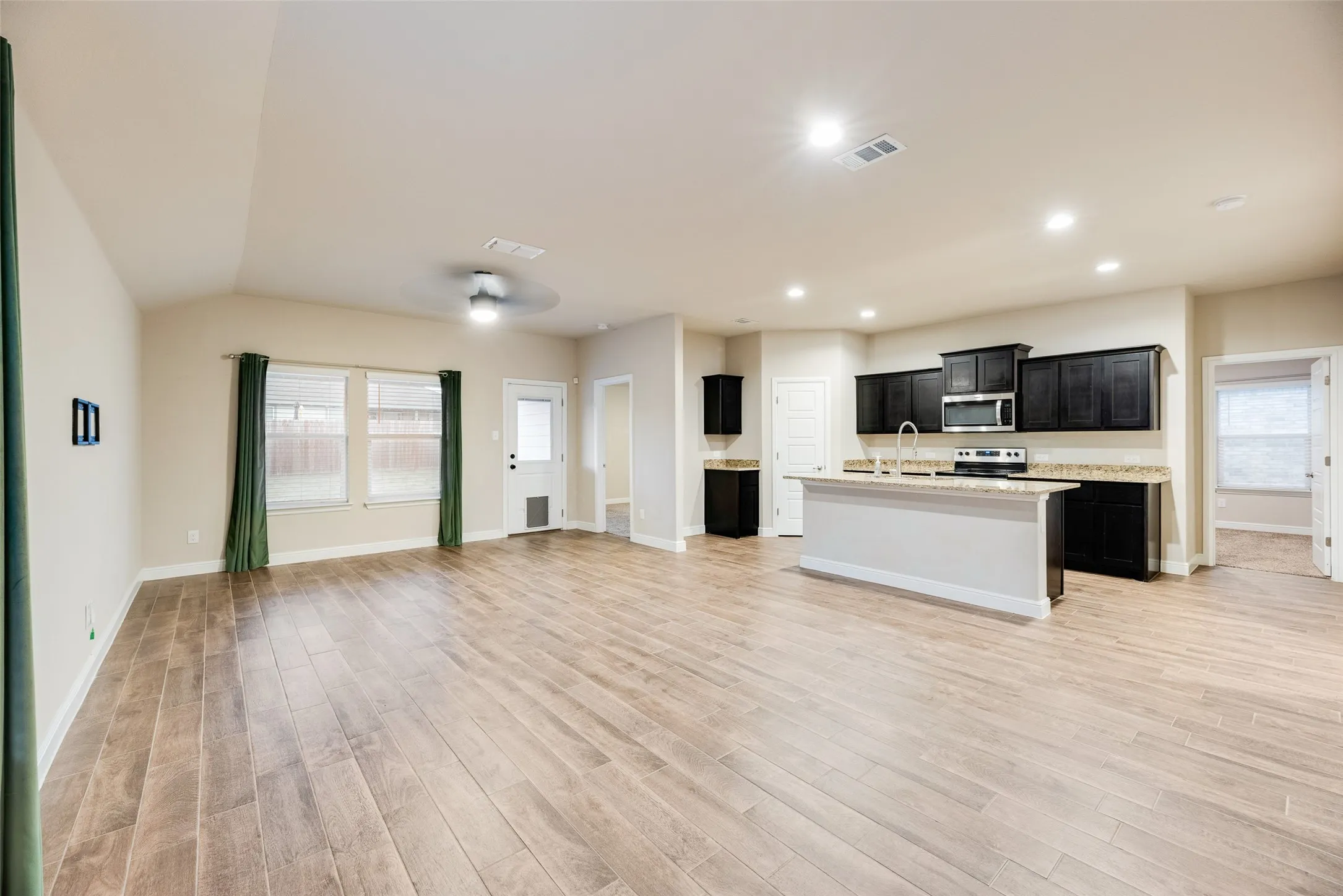 Wood-finish flooring throughout the main living space