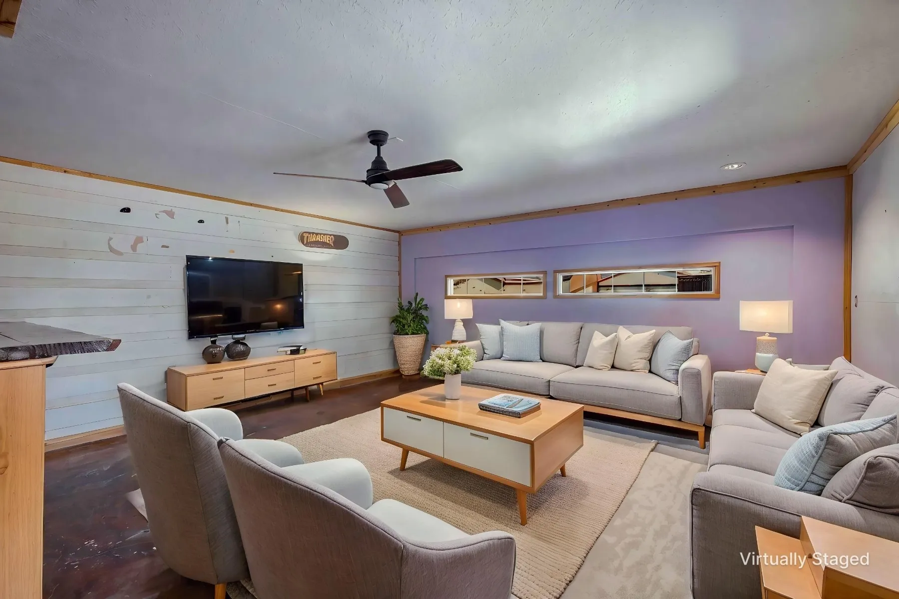 Virtually staged photo - Converted garage area showcasing what an additional living space could look like.