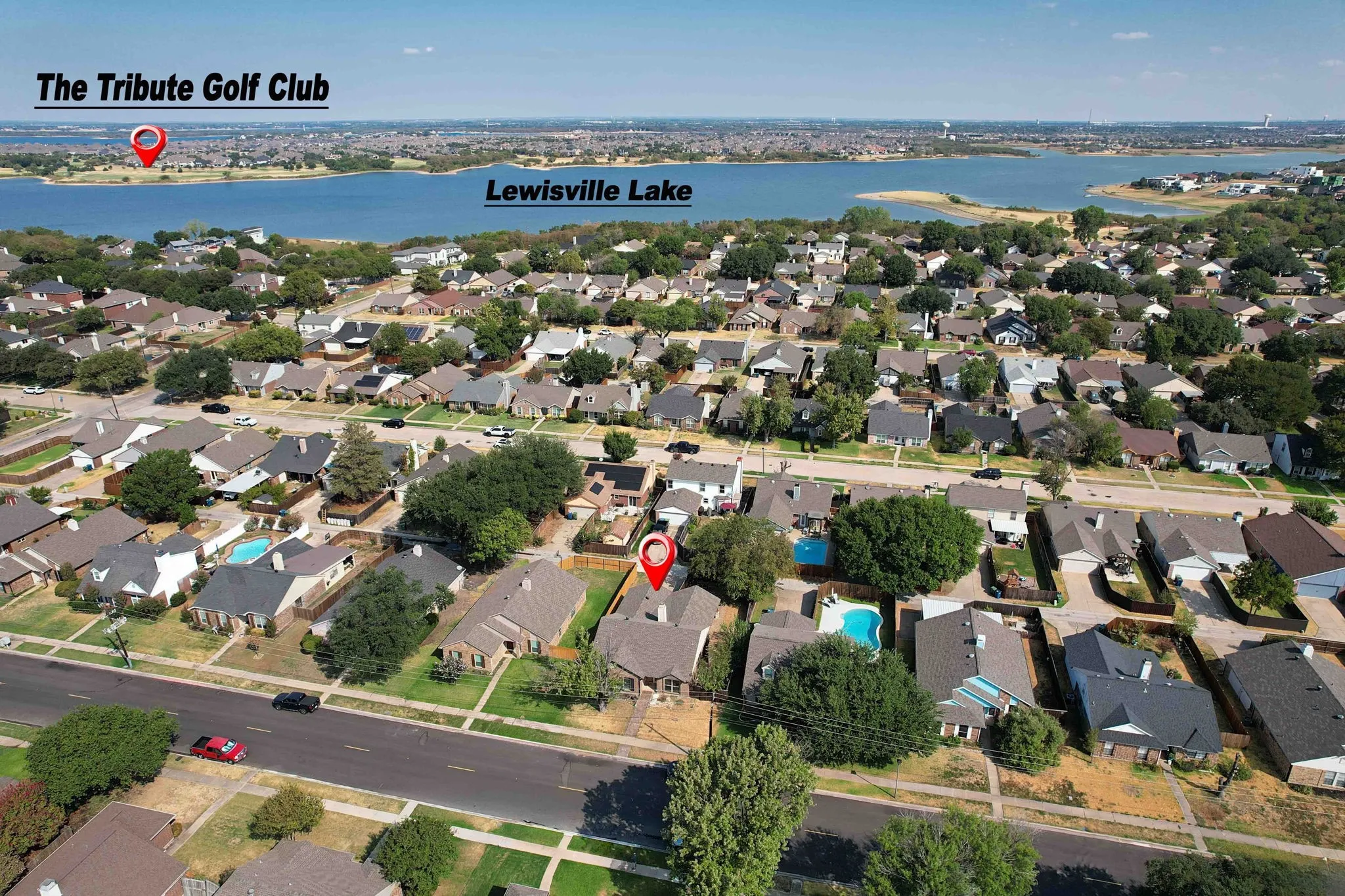 Aerial view of property and surrounding area. Lewisville lake in the background.
