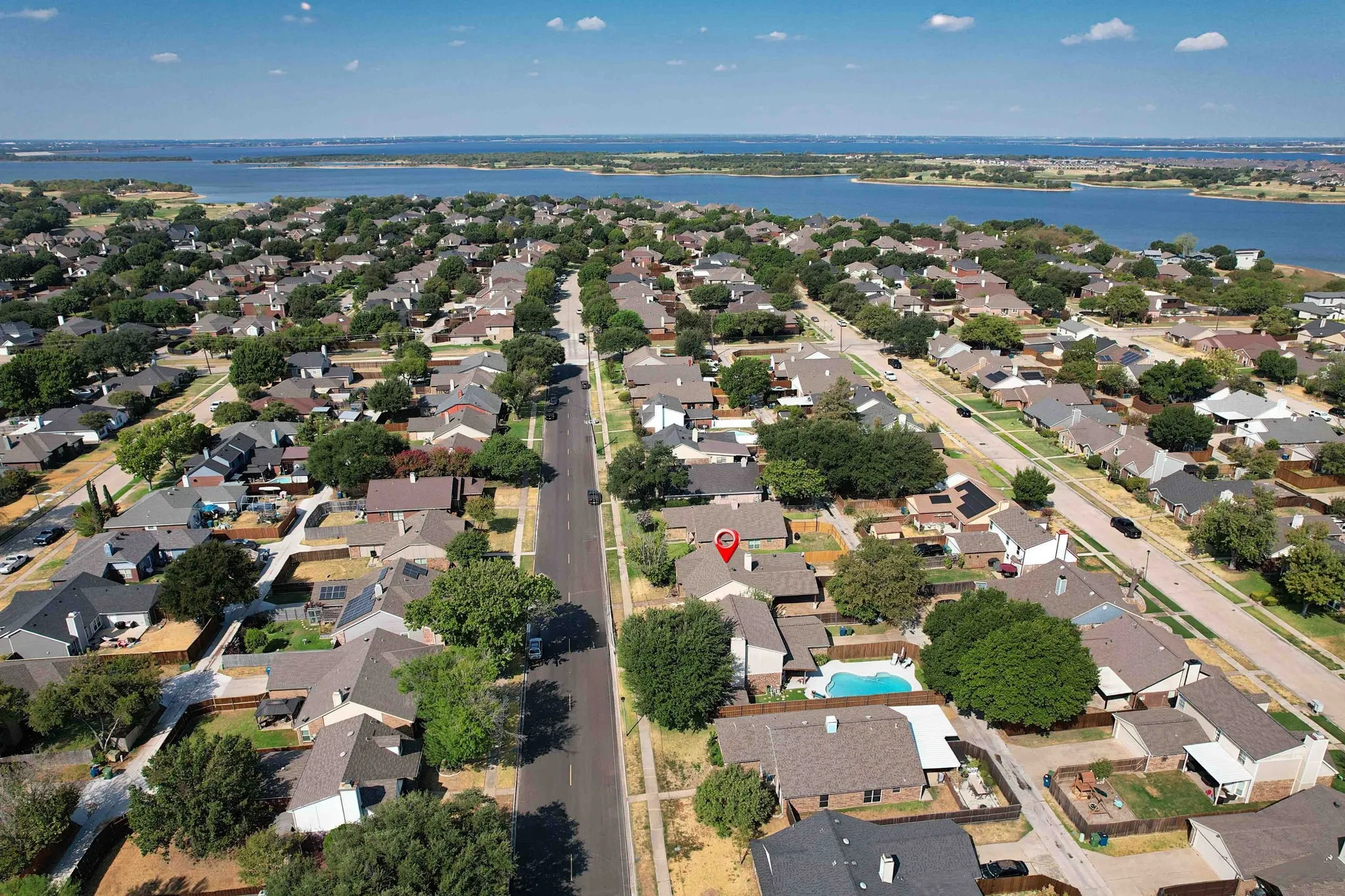 Aerial view of property and surrounding area. Lewisville lake in the background.