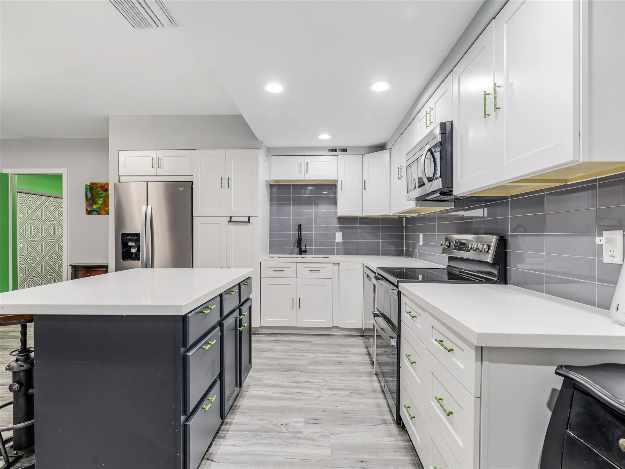 Fabulous kitchen layout with island provides tons of storage and countertop workspace.