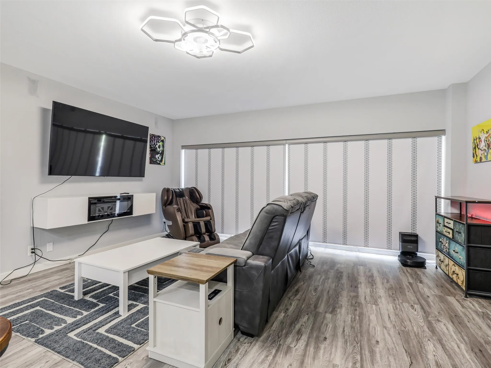 Open living and dining room combo in the center of the home, between the split dual primary suites.
