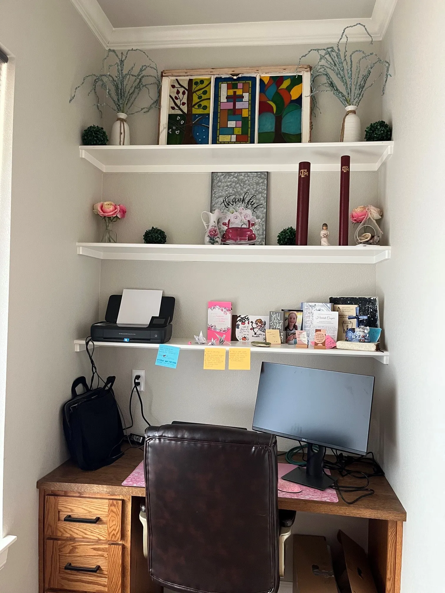 Built-in wooden desk with two drawers, integrated wall shelves, and crown molding