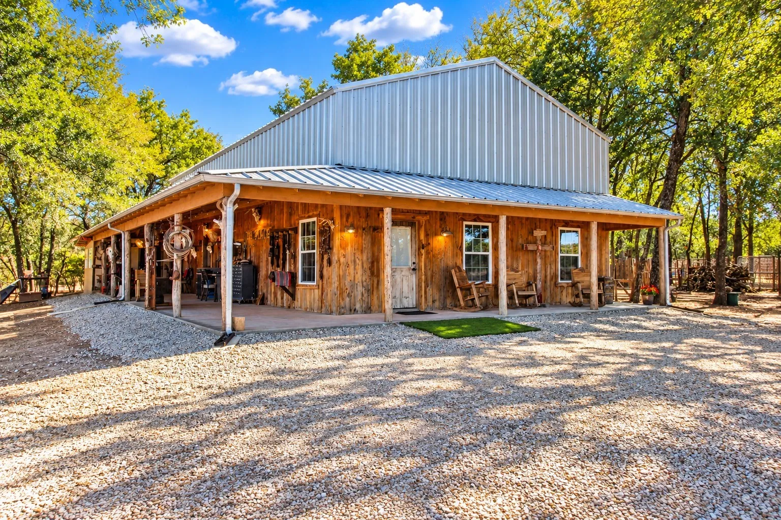 Exterior featuring a metal roof, wood siding, and an expansive covered porch