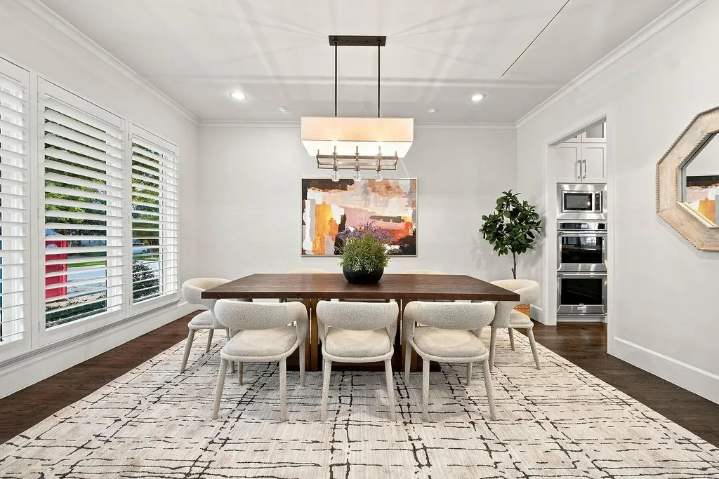 Sunlight pours into this dedicated dining space, creating a lovely setting for Sunday brunches and holiday meals