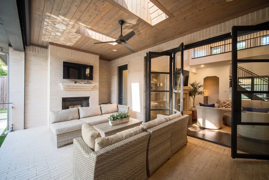 Folding glass doors push completely out of the way, making it easy to carry drinks and food right out to the covered back patio