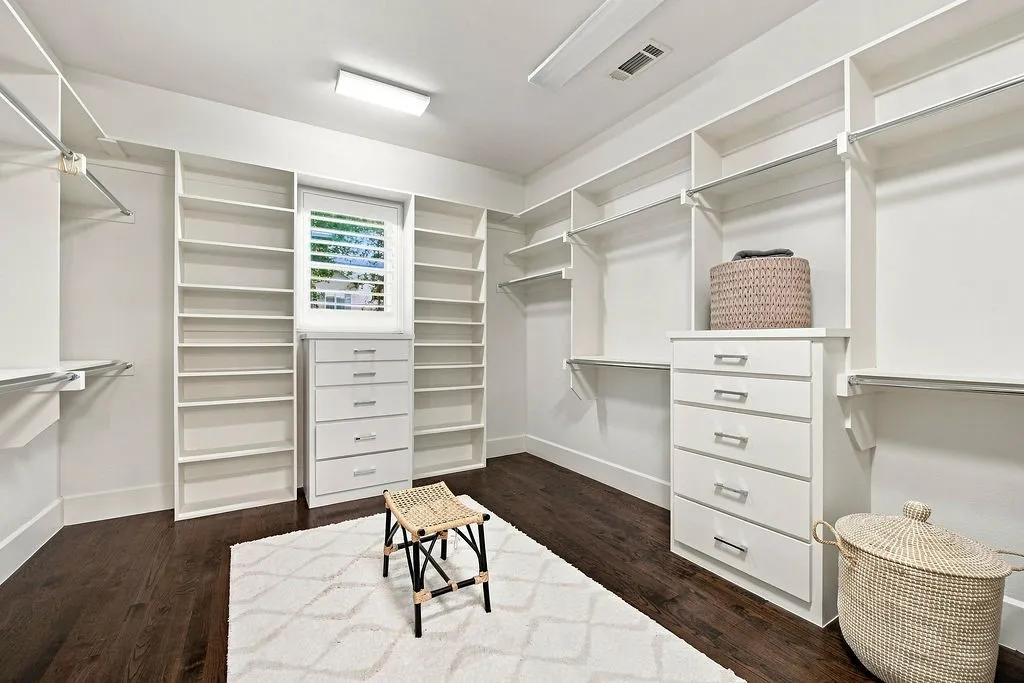 Custom built-in shelving, shoe racks, and drawers keep your wardrobe neatly arranged and easy to find