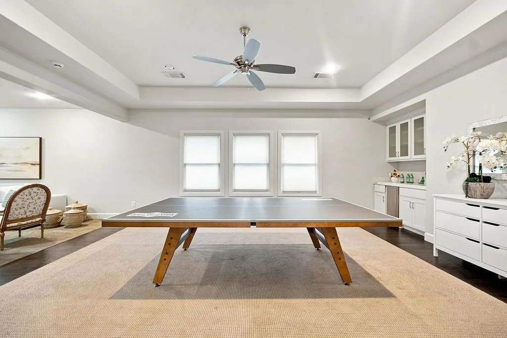 Recessed lighting and warm accents make this second-floor common area a cozy hangout spot for all ages