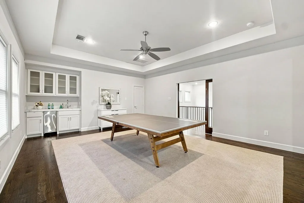 This huge upstairs space is ready for game nights, with plenty of floor room for a pool table, lounge chairs, and board games