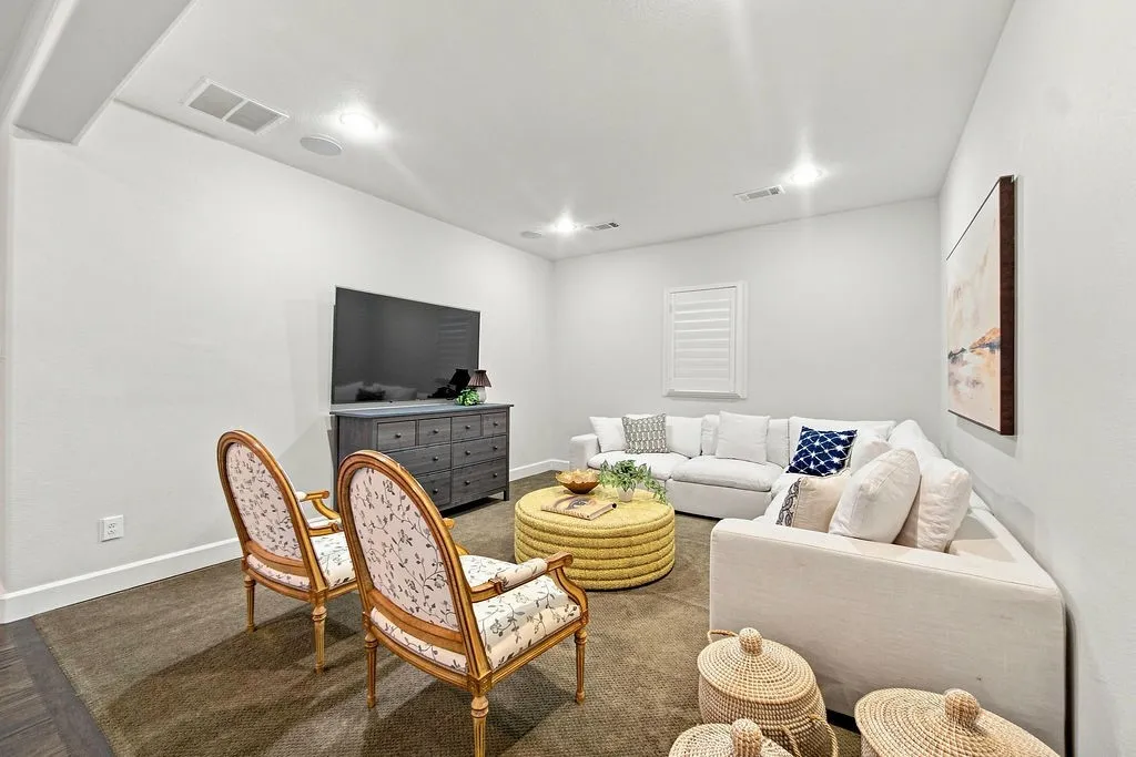 Set up a big plush sofa and TV in this quiet upstairs corner for movie nights and weekend sports games
