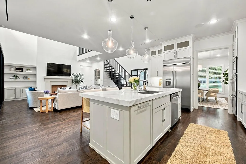 The continuous layout lets you prep dinner while staying completely connected to everyone relaxing in the living room