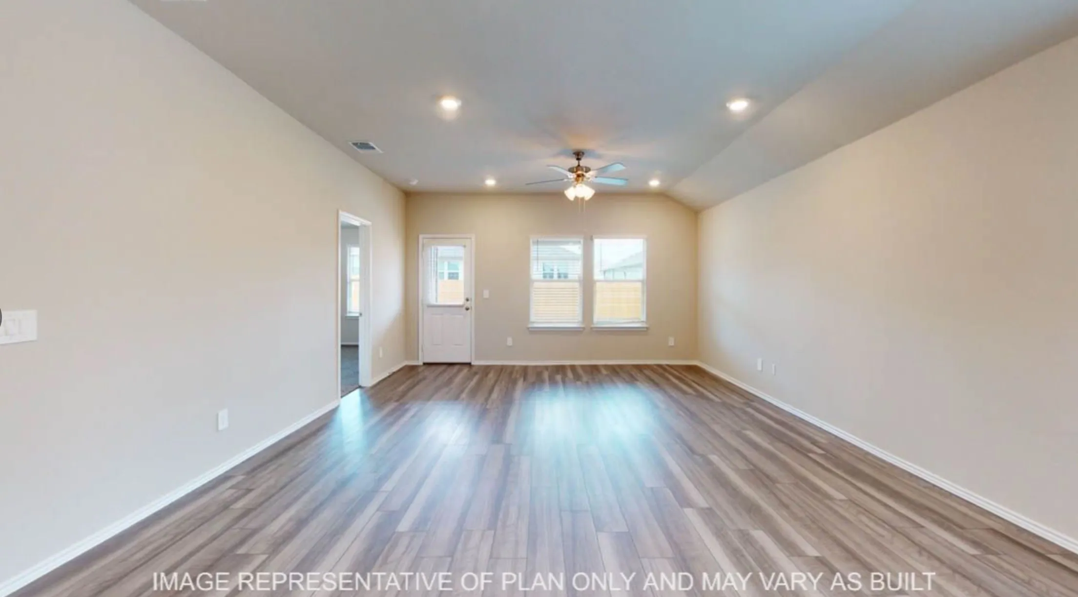 Wood-finish flooring, recessed lighting, ceiling fan, and multiple windows