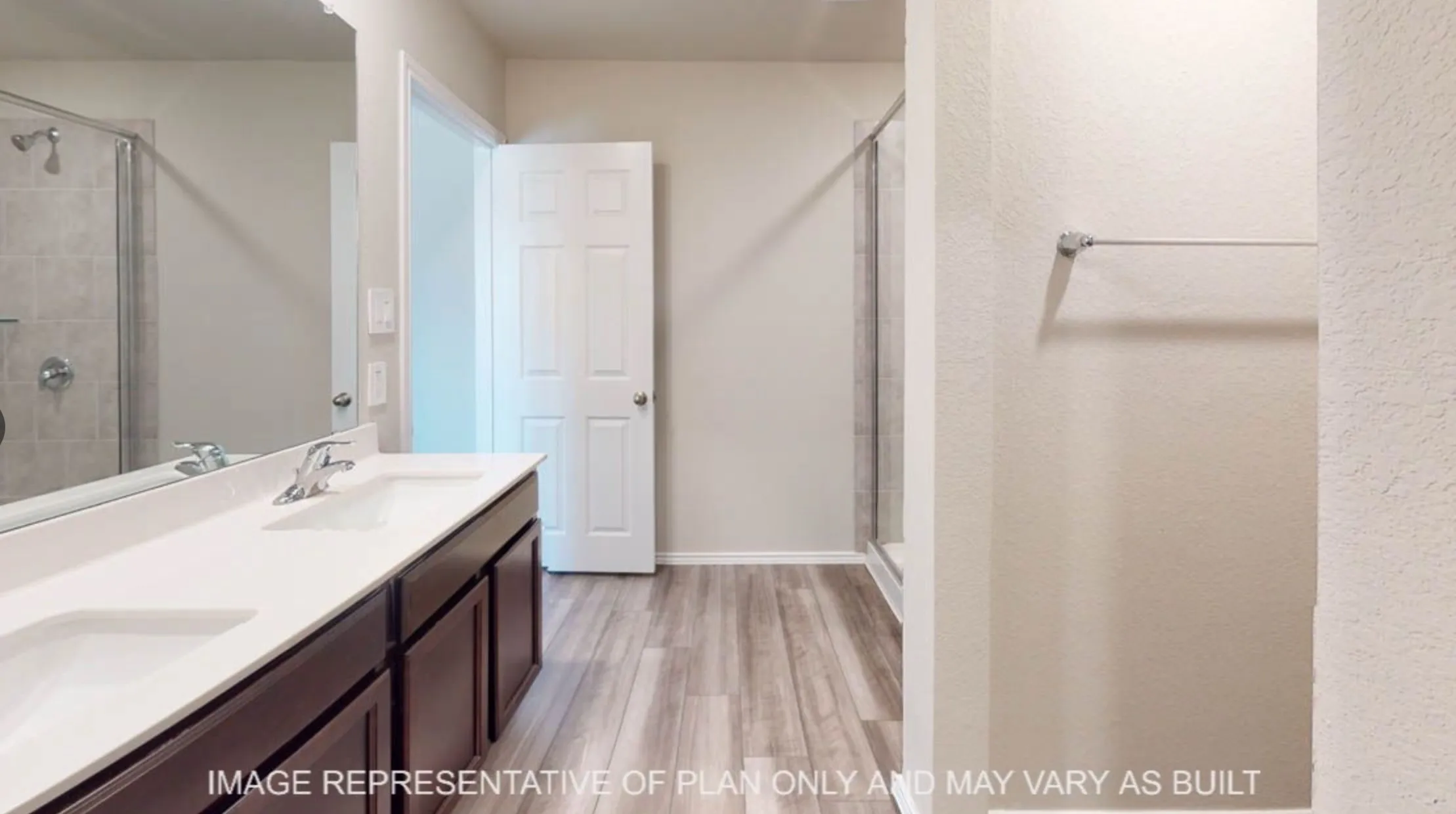Dual vanity with white countertop, chrome fixtures, and dark wood-finish cabinetry