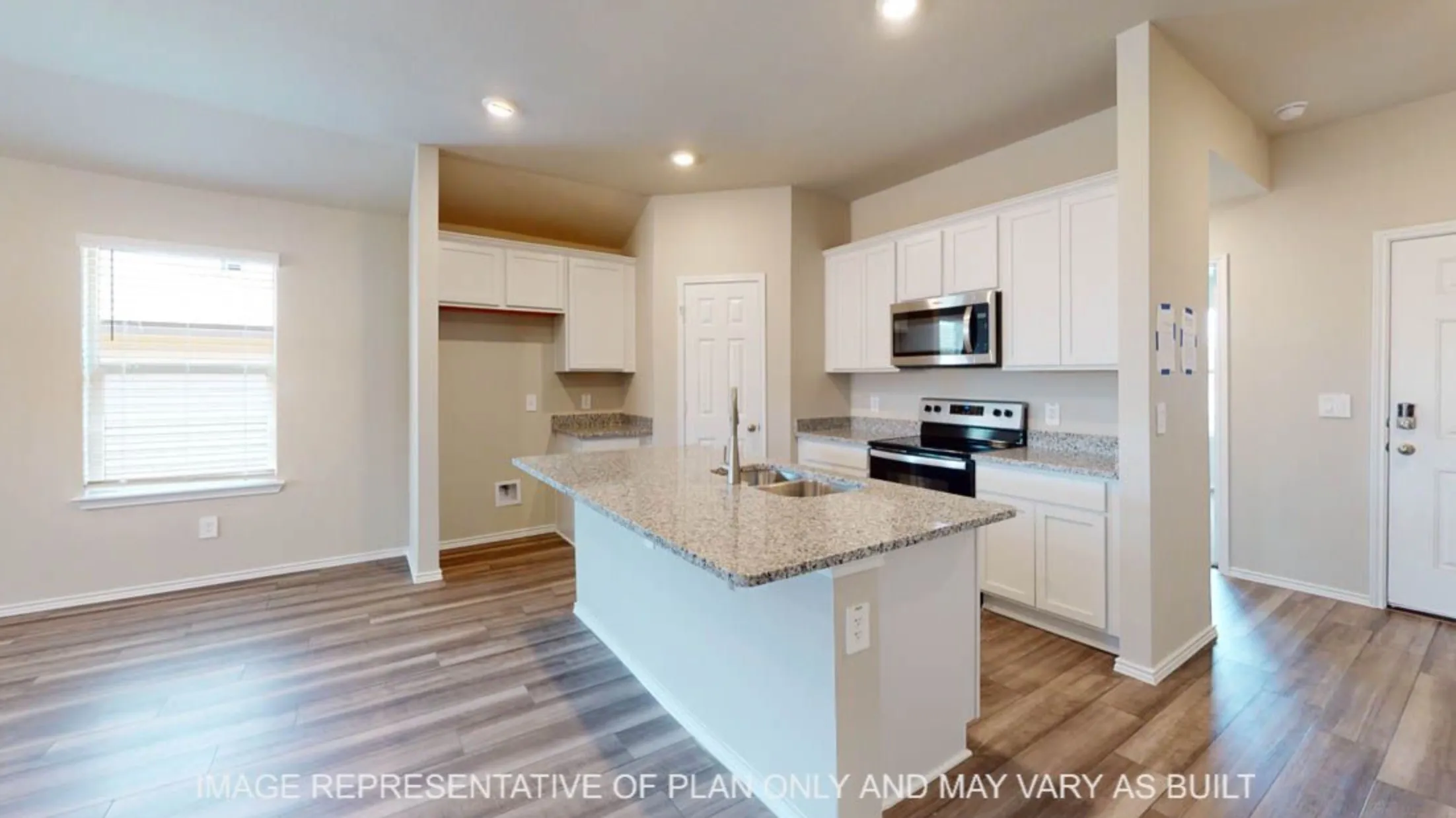 Contemporary kitchen featuring white cabinetry, stainless steel appliances, granite countertops, a center island with sink, and wood-finish flooring
