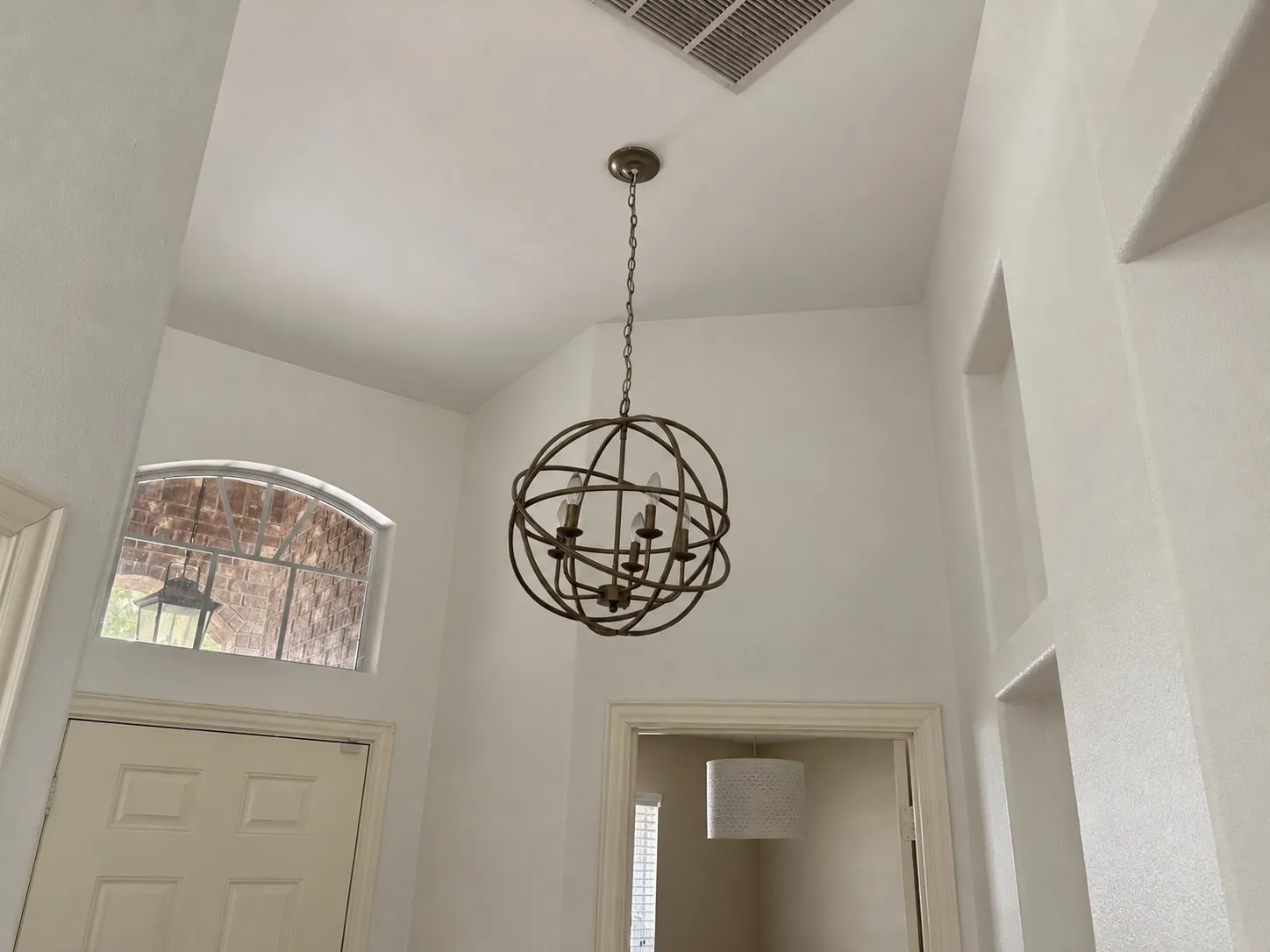 Vaulted ceiling with an architectural light fixture
