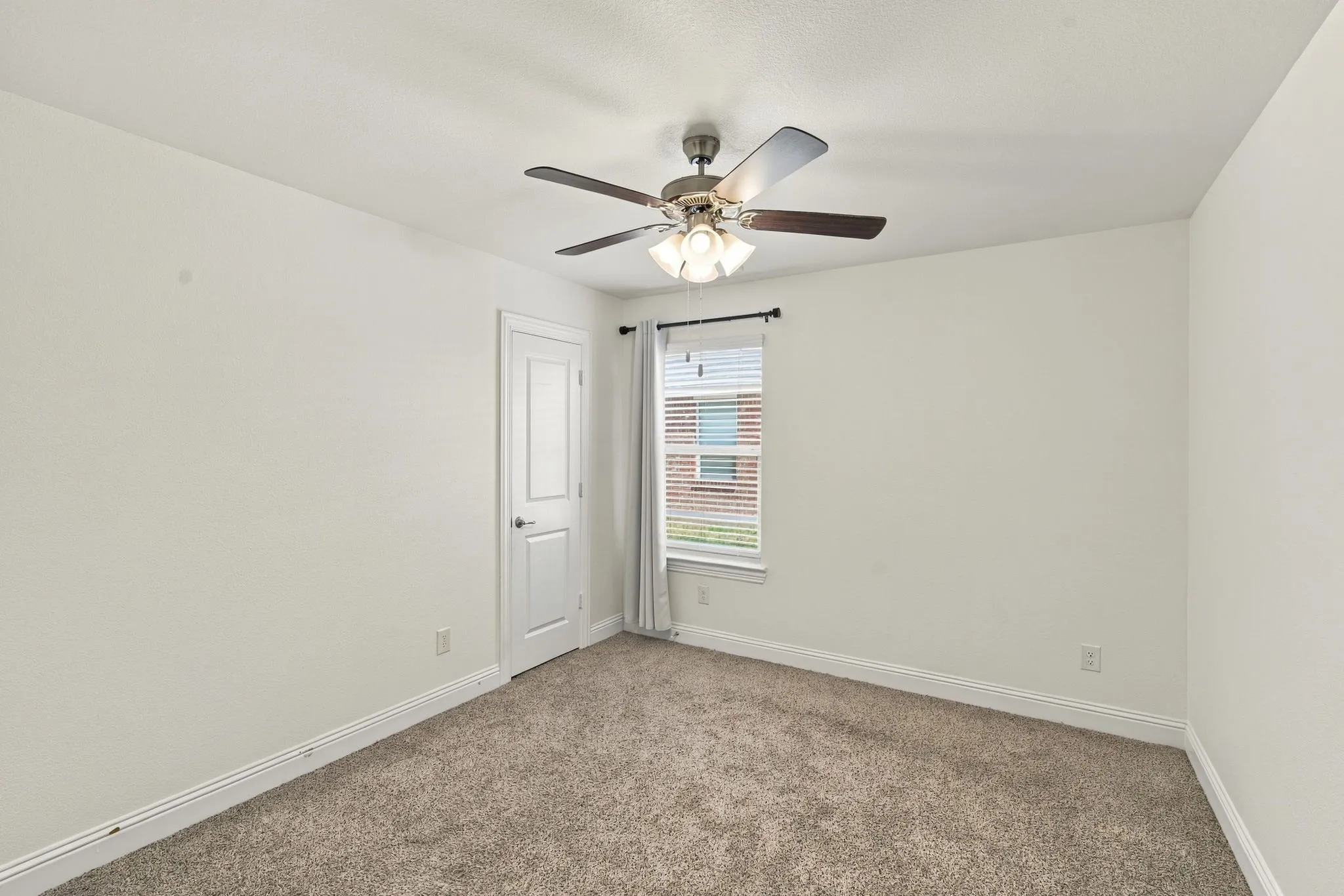 Recessed lighting, ceiling fan with integrated lighting, window with blinds, and neutral carpeting