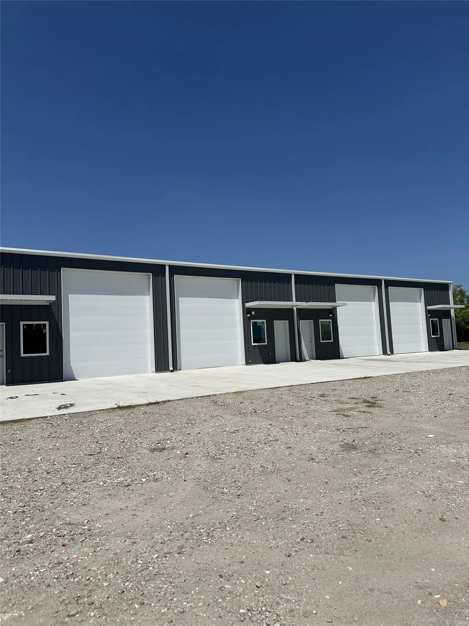 4 Units each with a Garage door and walk through door.