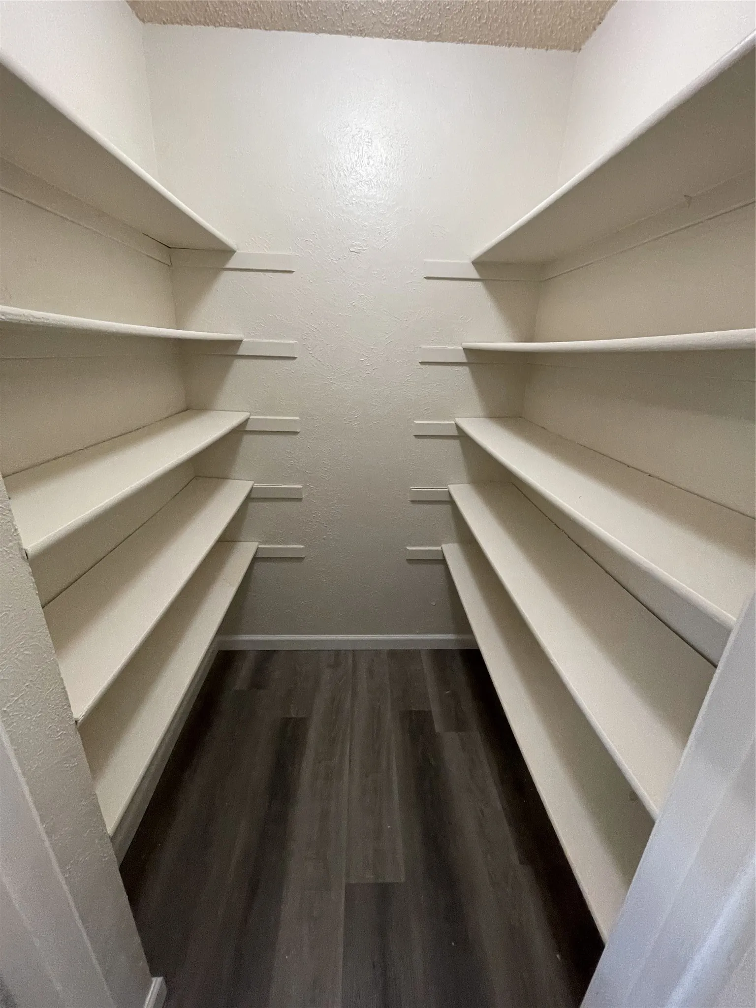 Built-in shelving on both sides, offering extensive storage