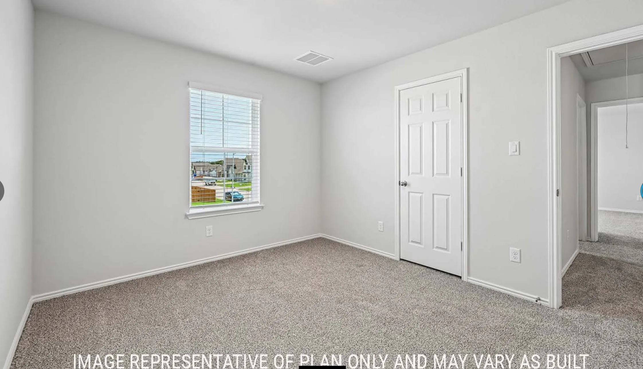 Neutral wall paint, textured carpet flooring, white window blinds, white paneled door, and white trim throughout