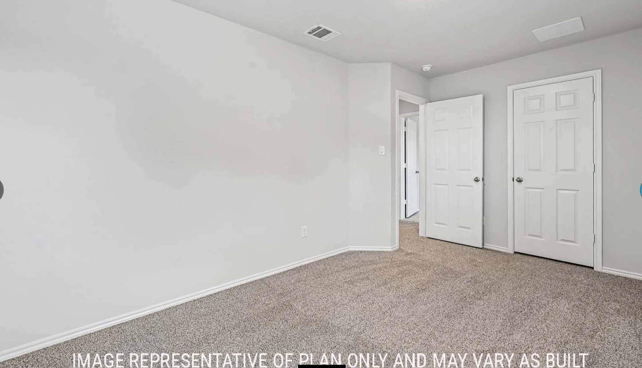 Neutral gray wall finishes and light brown carpet flooring