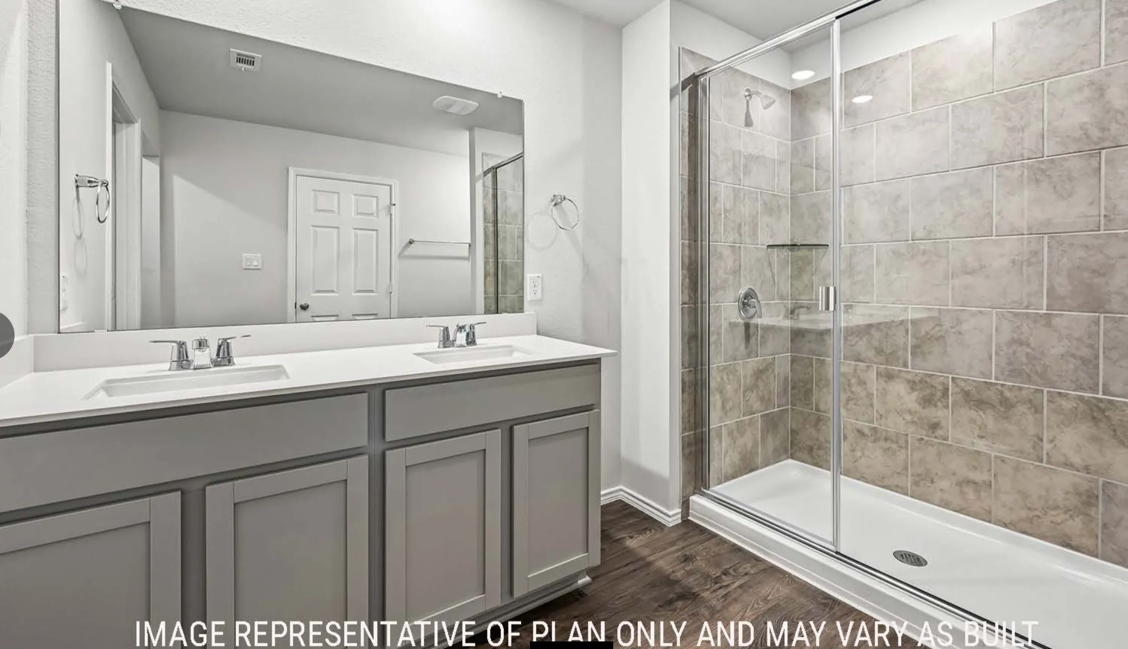 Dual vanity with undermount sinks and light-colored countertops