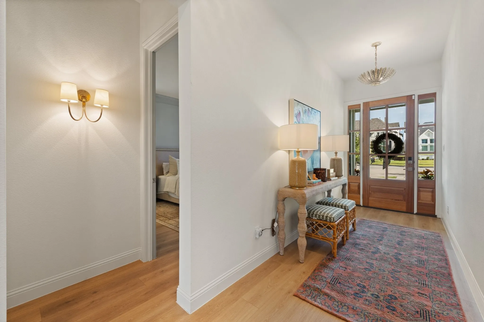 Grand entry with high ceilings and custom light fixtures
