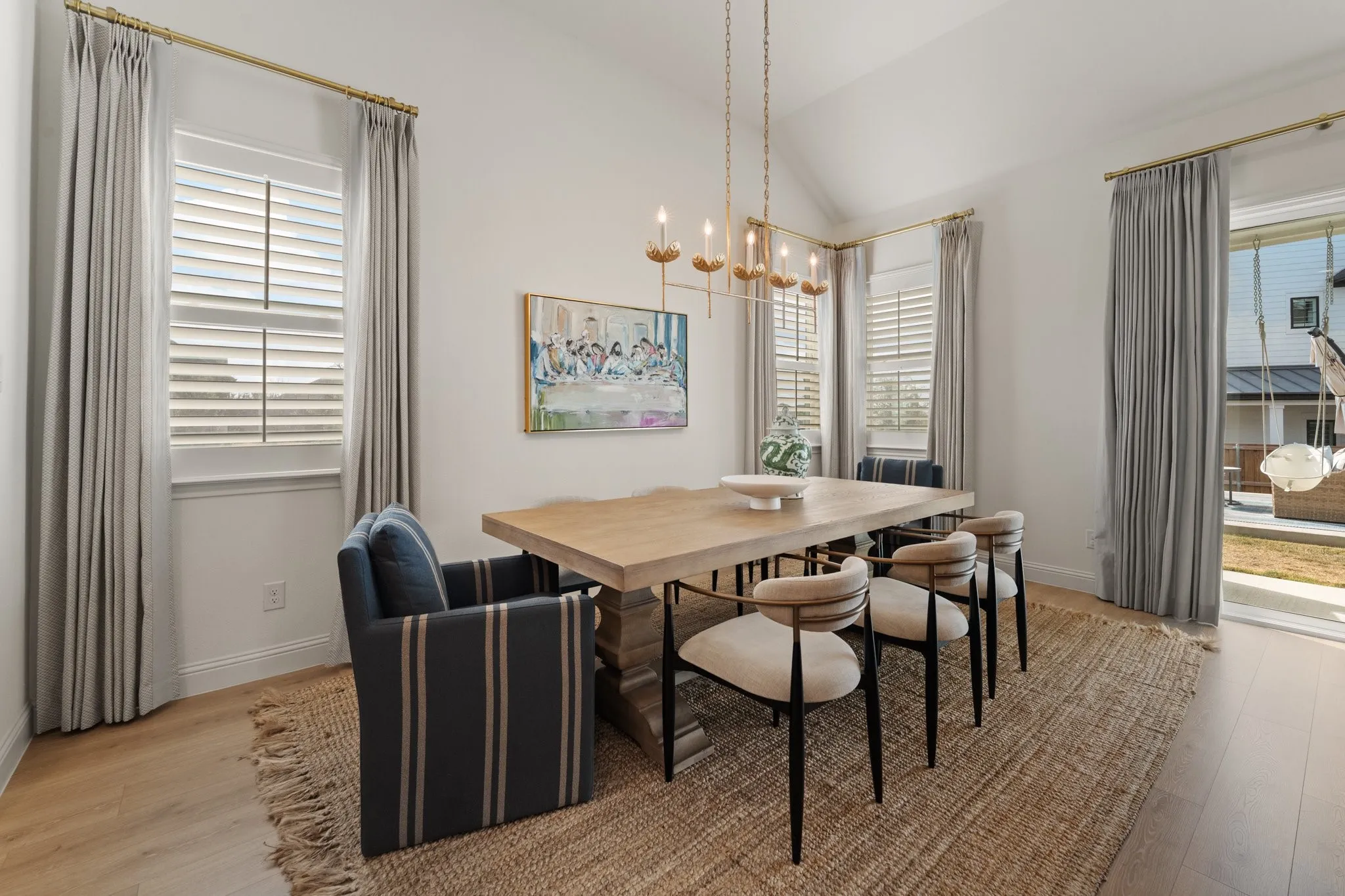 plantation shutters and designer chandelier