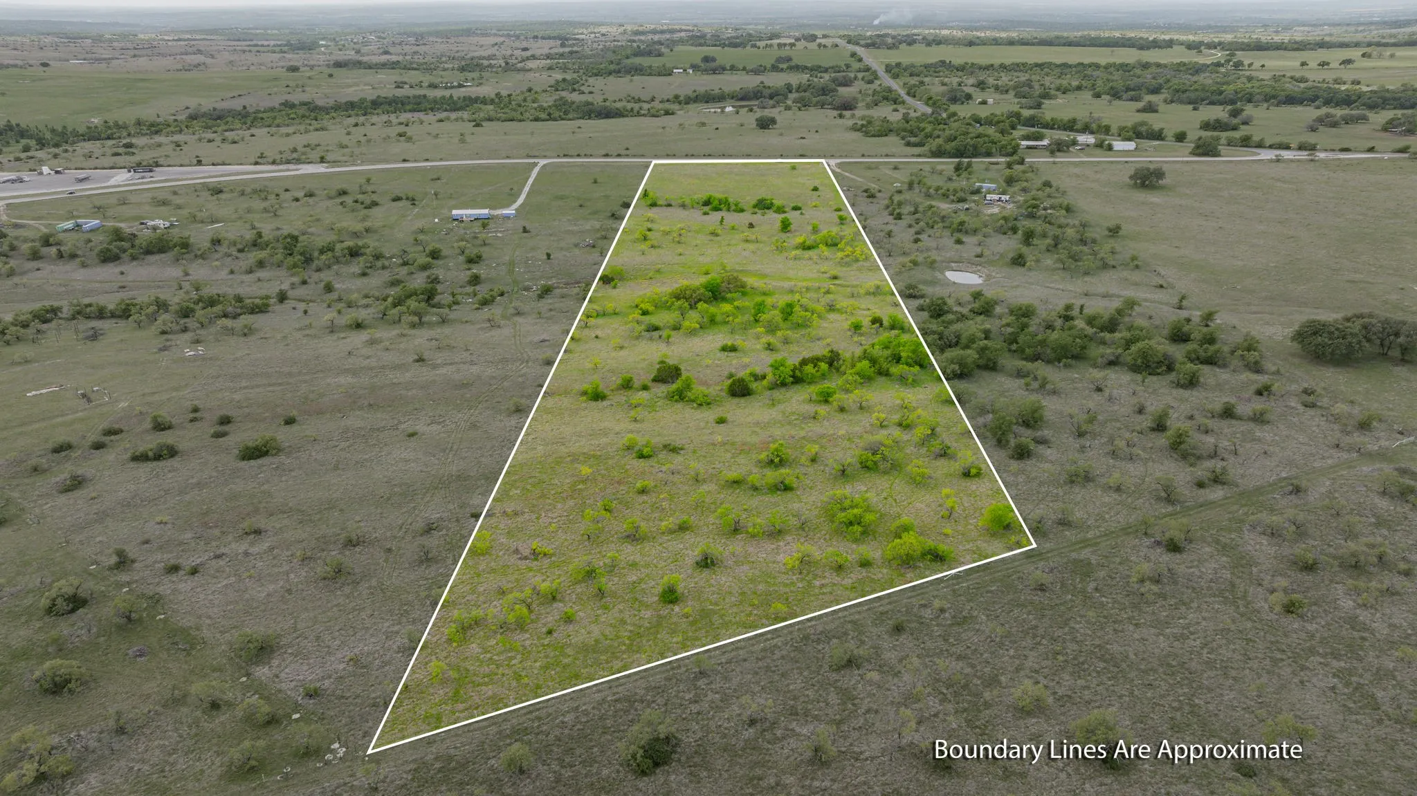 Expansive undeveloped land featuring varied terrain and natural vegetation