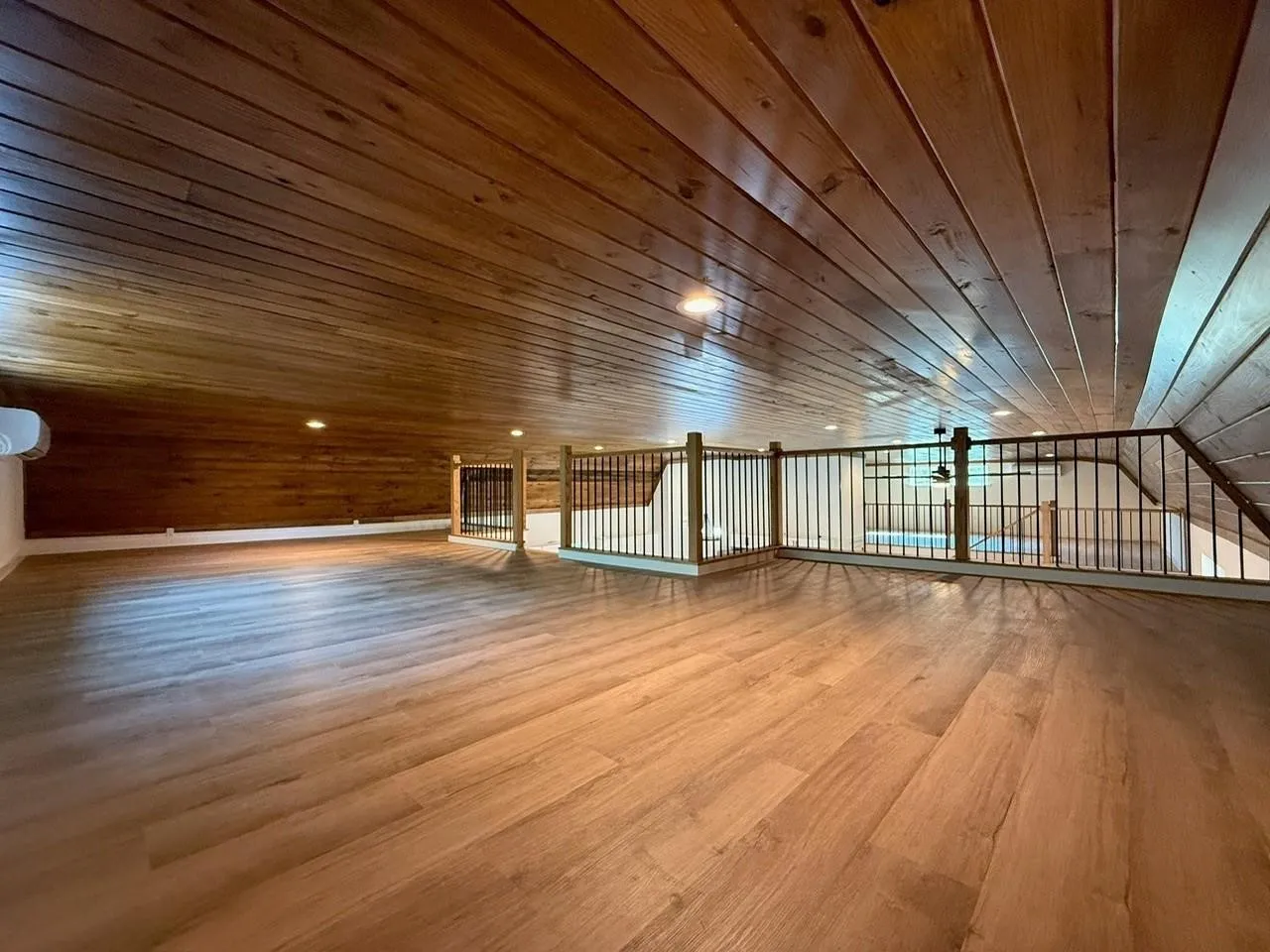 Wood-finish flooring, wood plank ceiling, and wood paneling