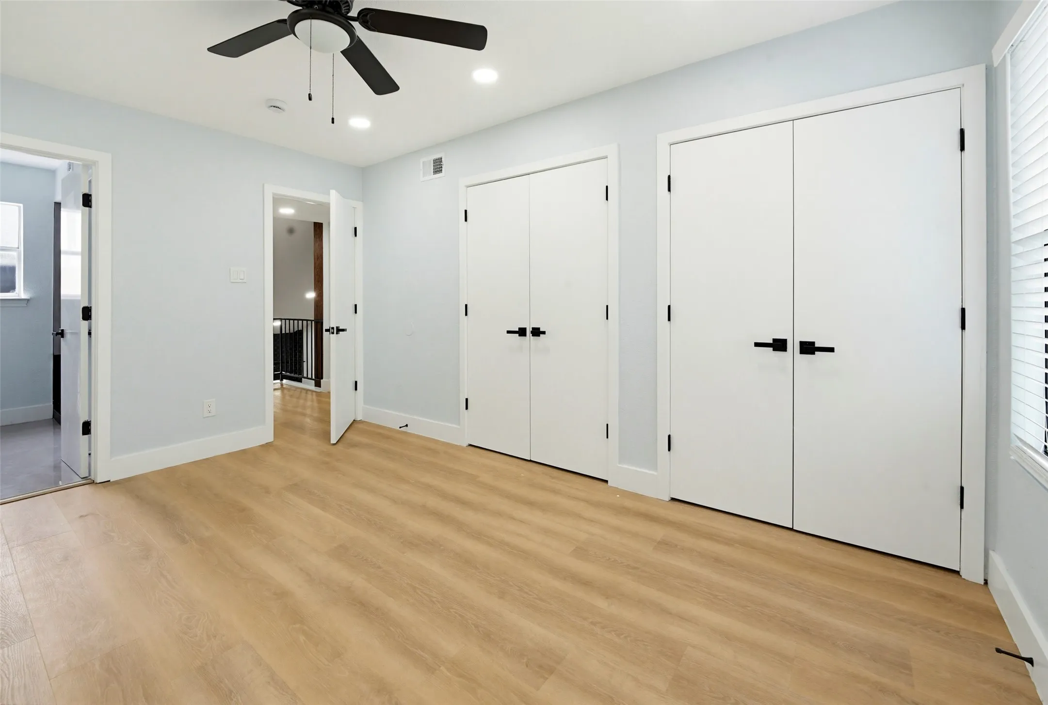 Wood-finish flooring, recessed lighting, and a ceiling​​‌​​​​‌​​‌‌​‌‌​​​‌‌​‌​‌​‌​​​‌​​ fan