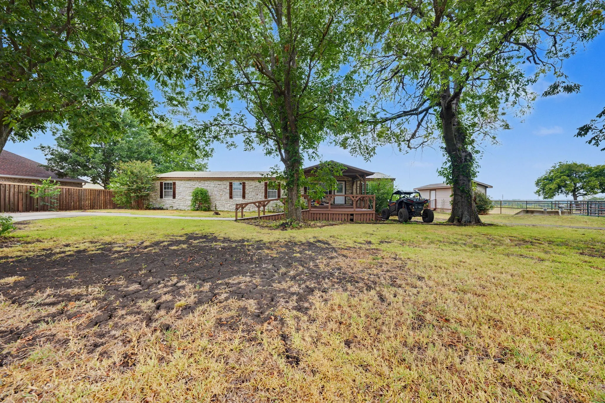 Storage shed located to the right of the property with a small drive up ramp for easy storage.