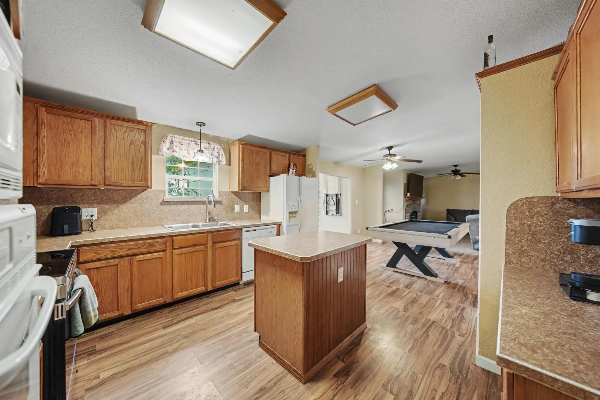 A kitchen that flows into the living room, creating an open and connected space.
