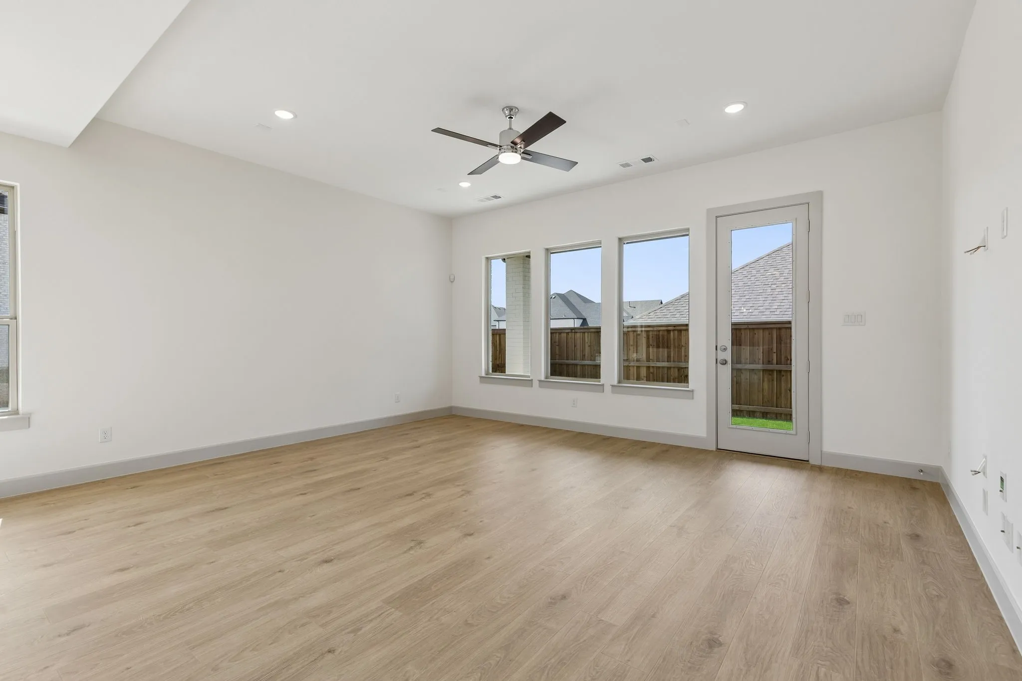 Light and bright, this family room is spacious enough to host the entire family!