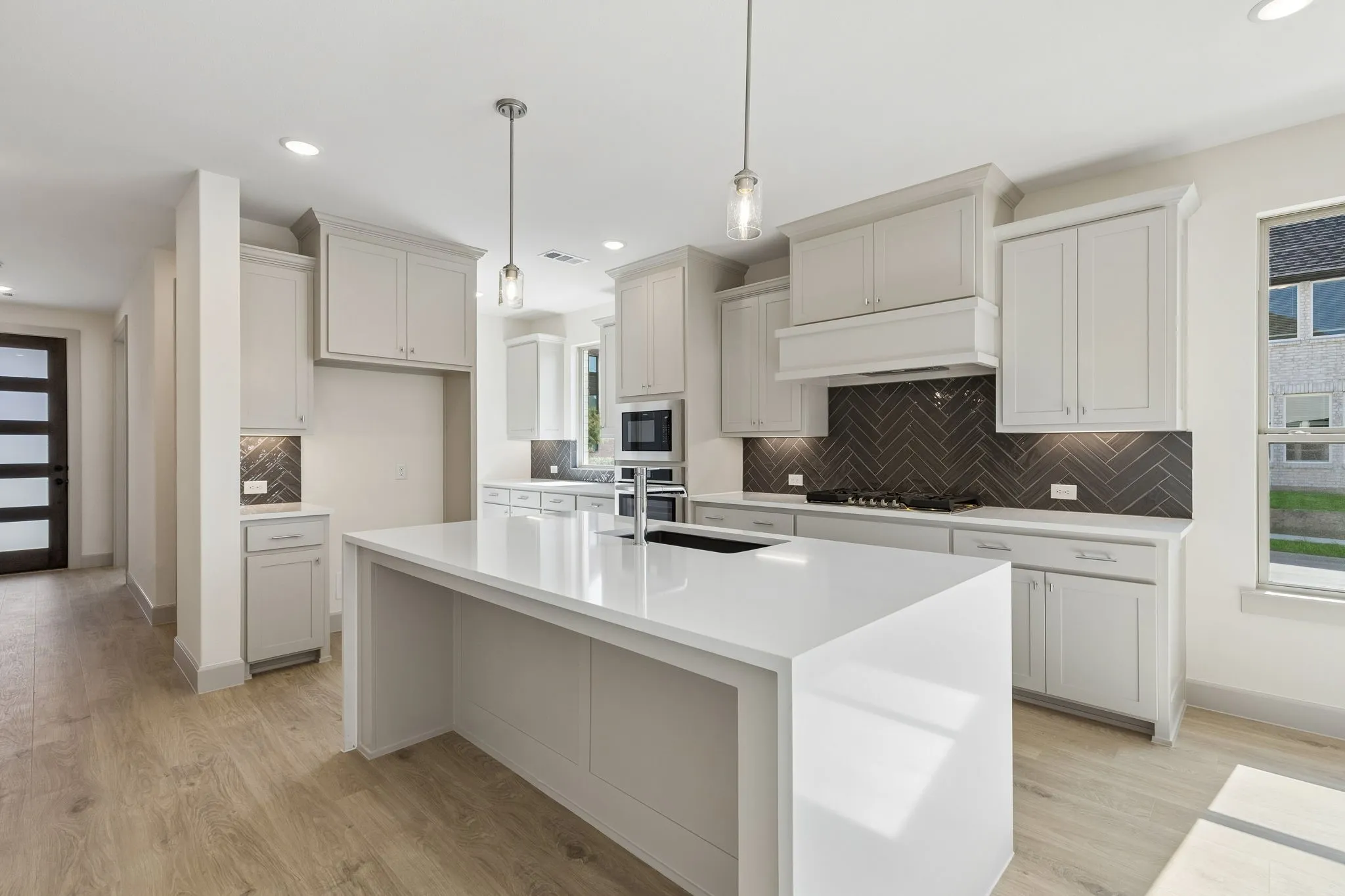 This beautifully finished Juliet floor plan features a dream kitchen filled with tons of storage and prep space!