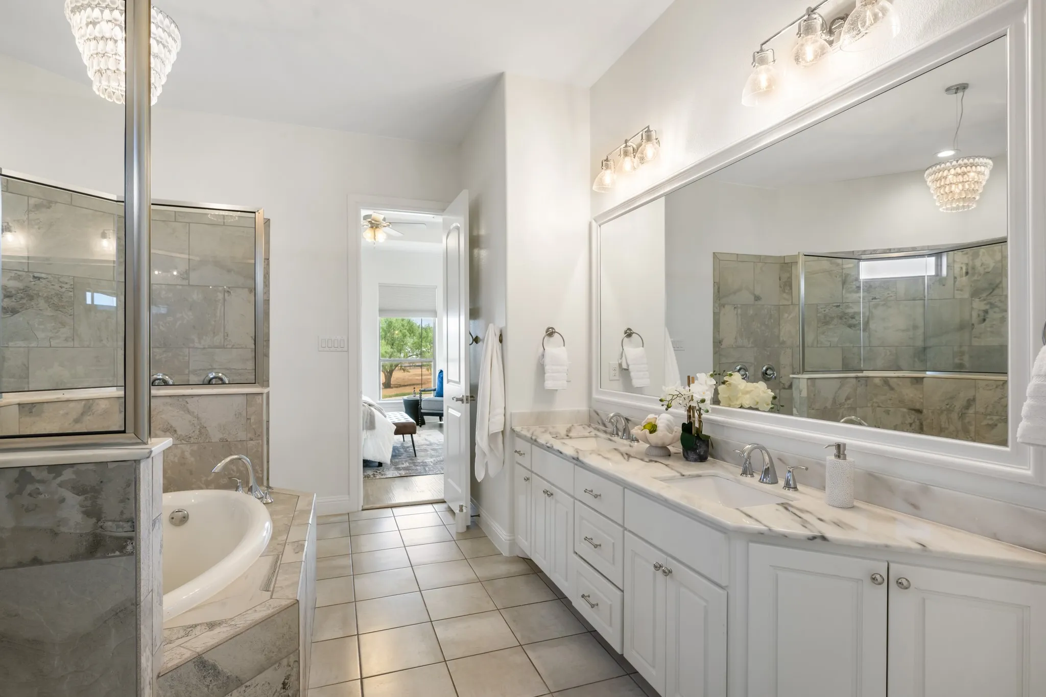 Dual vanity with stone countertops and undermount sinks