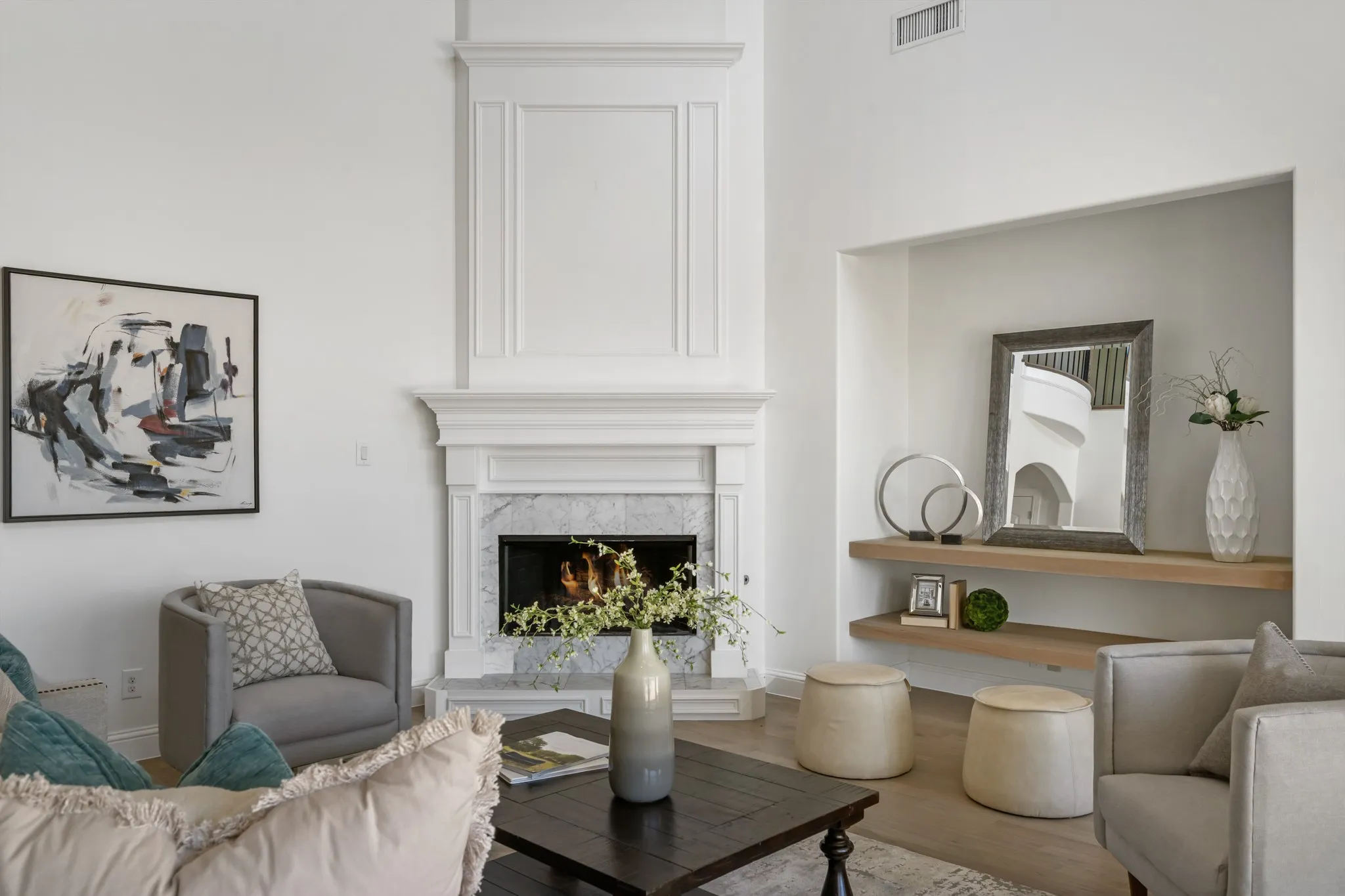 Fireplace featuring decorative mantel and marble-look surround