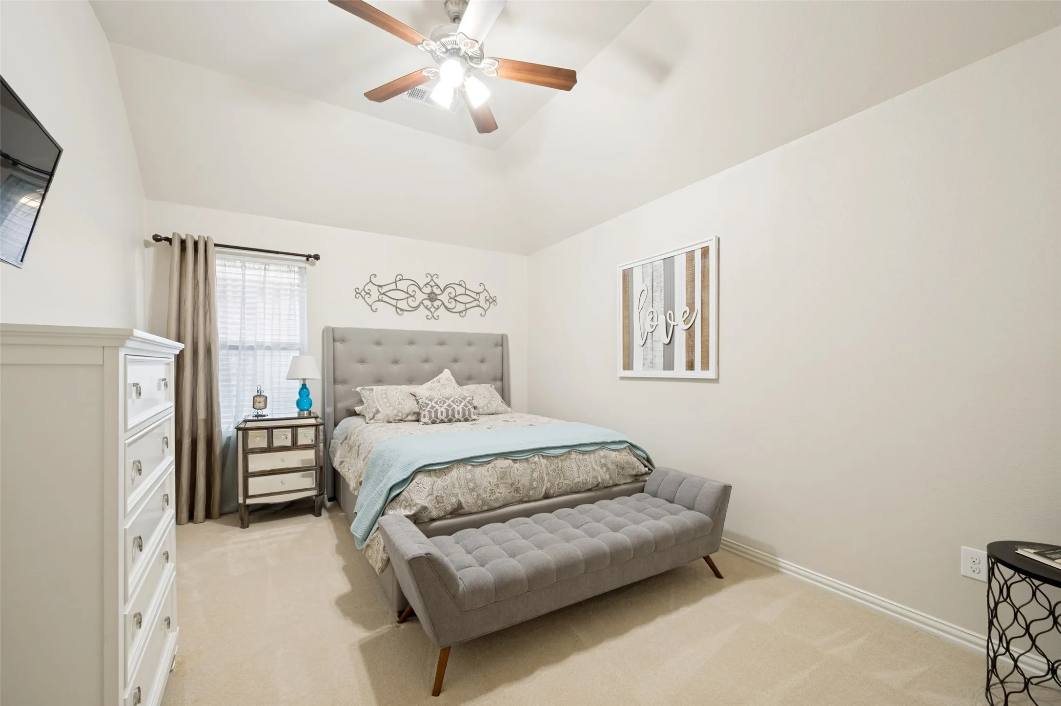 Generously sized secondary bedroom featuring soft plush carpet, a spacious closet, and large windows that bring in plenty of natural light.