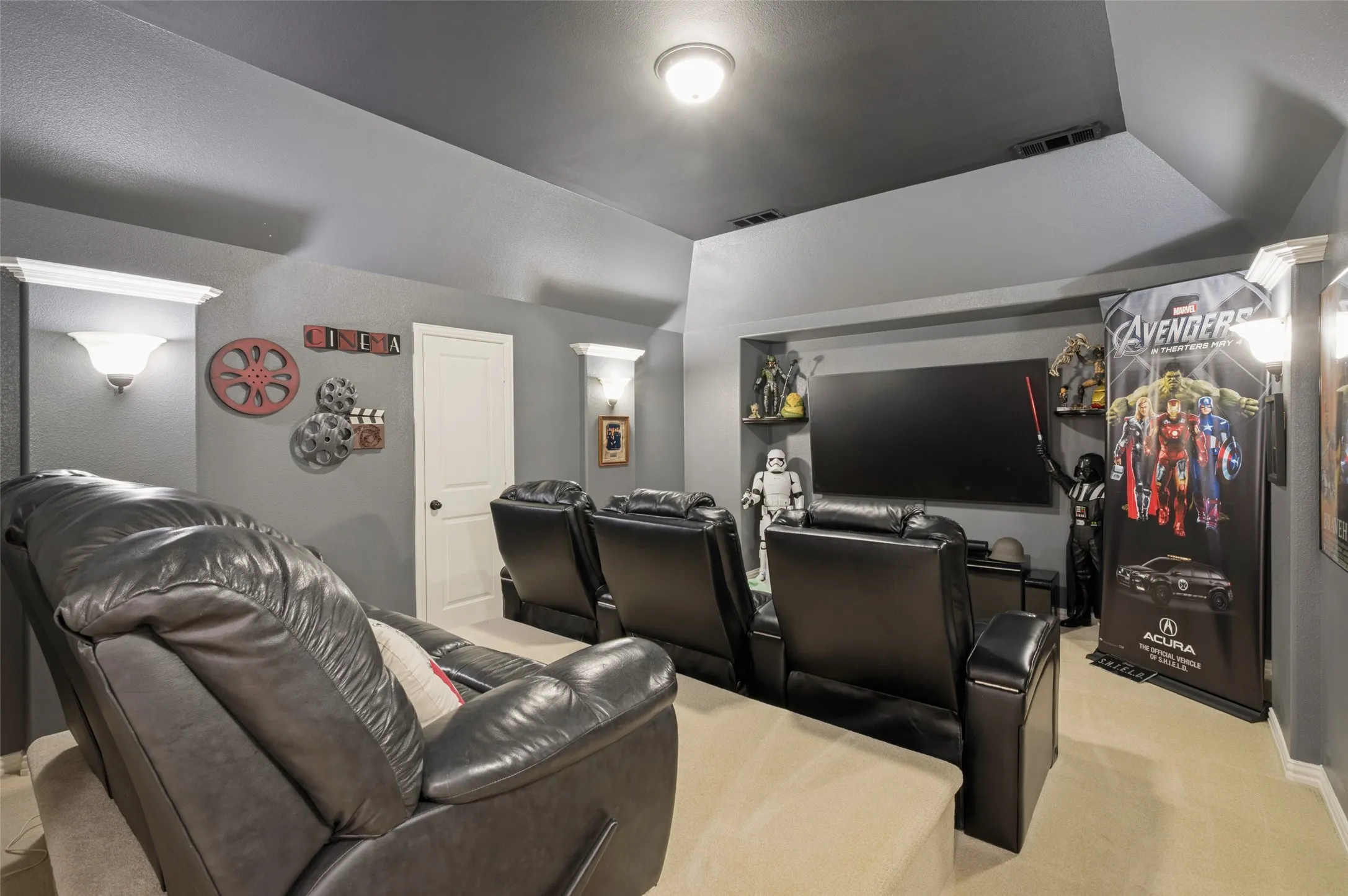 Movie nights reach a whole new level in this dedicated media room, complete with tiered seating, a projector-ready layout, and the perfect atmosphere for blockbuster films, game days, or binge-watching your favorite series.