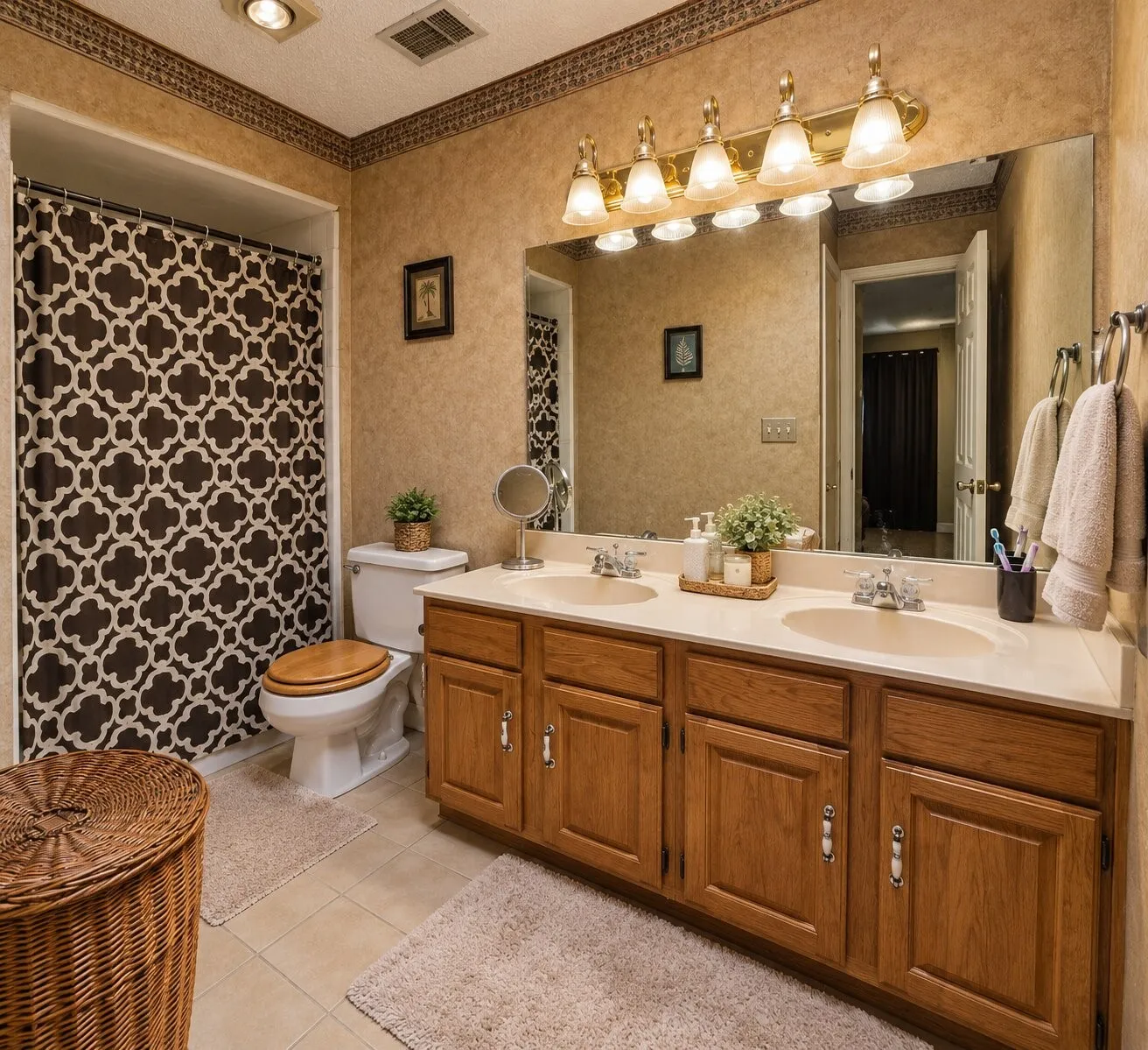 Dual vanity with integrated sinks and wood-finish cabinetry