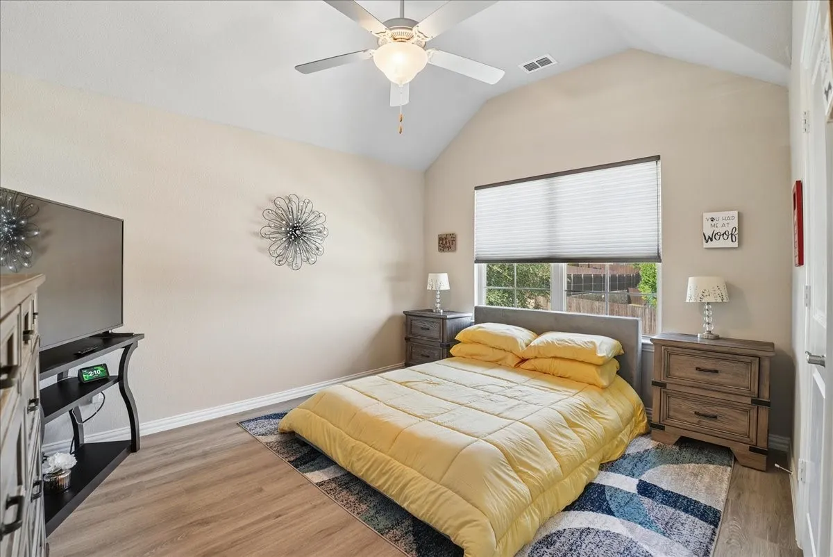 Spacious secondary bedroom with vaulted ceiling, natural light and private en-suite bath.